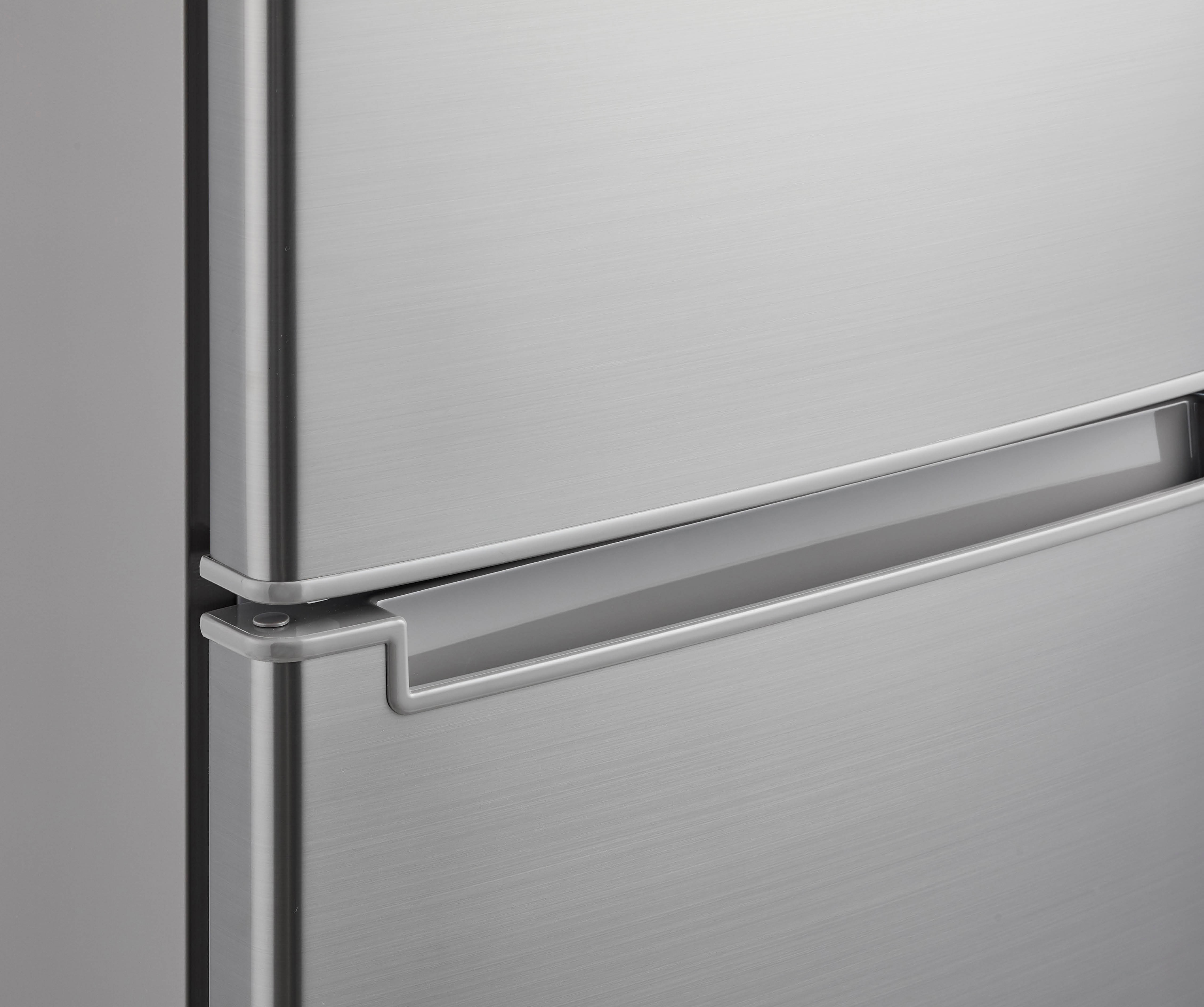 Close-up of a stainless steel refrigerator door with handle.