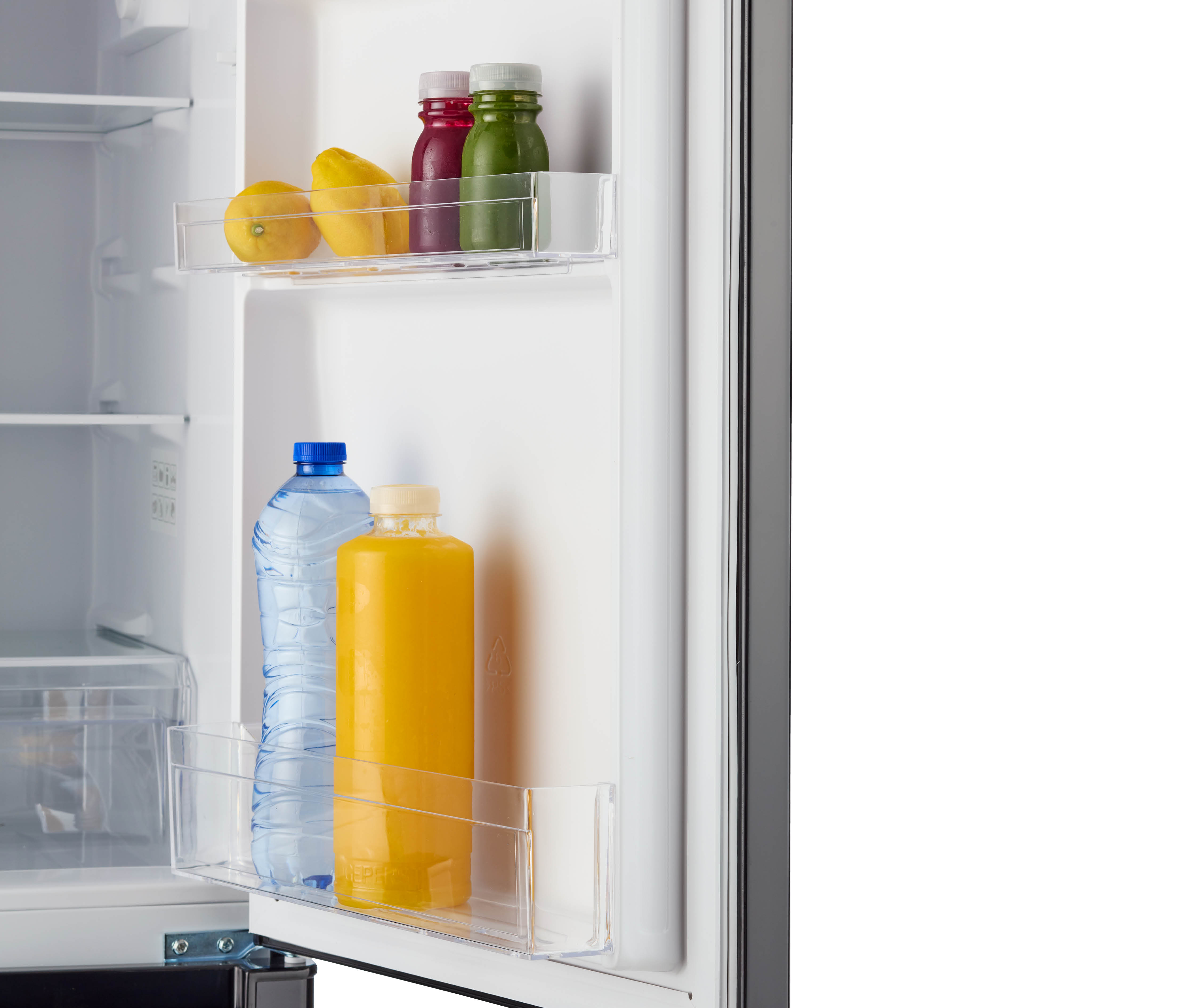 Inside a refrigerator with lemons, bottles of juice, and water. White interior.