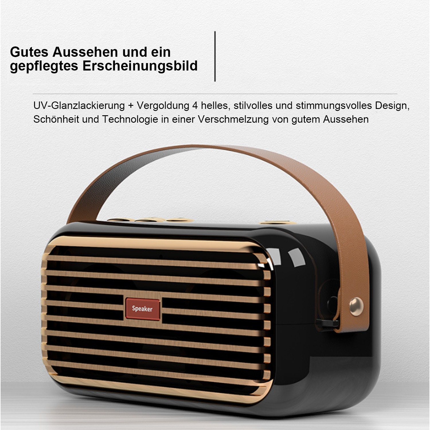 Ein schwarzer und goldfarbener Vintage-Lautsprecher mit braunem Griff und rotem Label 'Speaker'.