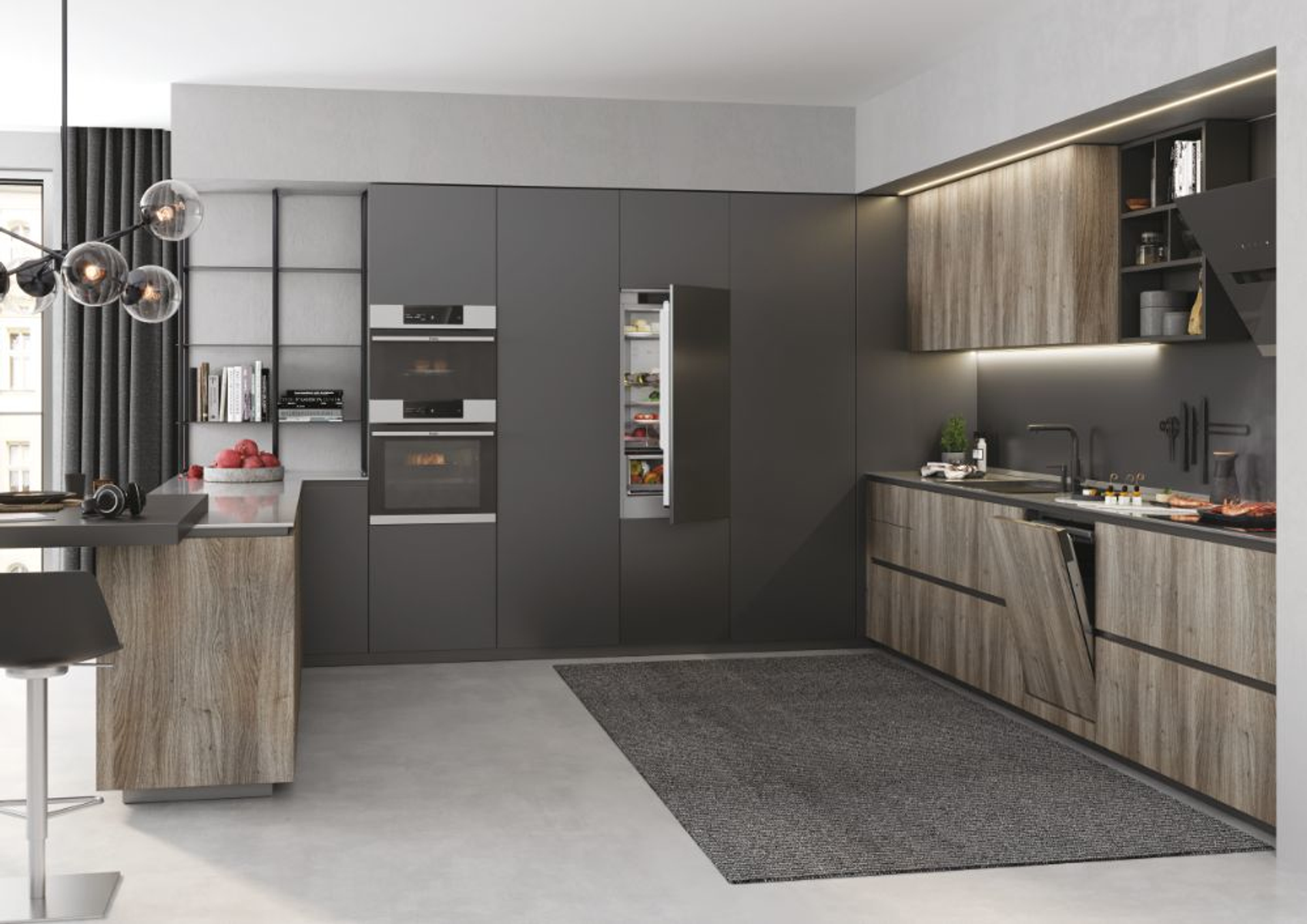 Una cucina moderna con elementi in legno e grigi, inclusi forni, frigorifero e lavastoviglie.