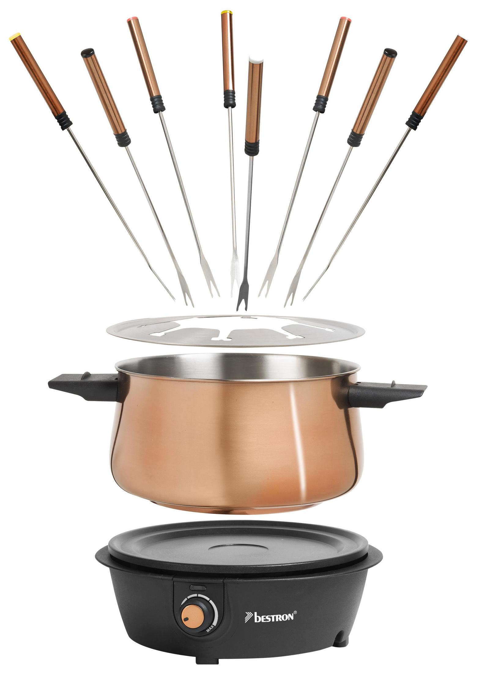 Ein Fondue-Set mit einem Kupfertopf und Brenner. Gabeln und ein Spritzschutz sind ebenfalls sichtbar.