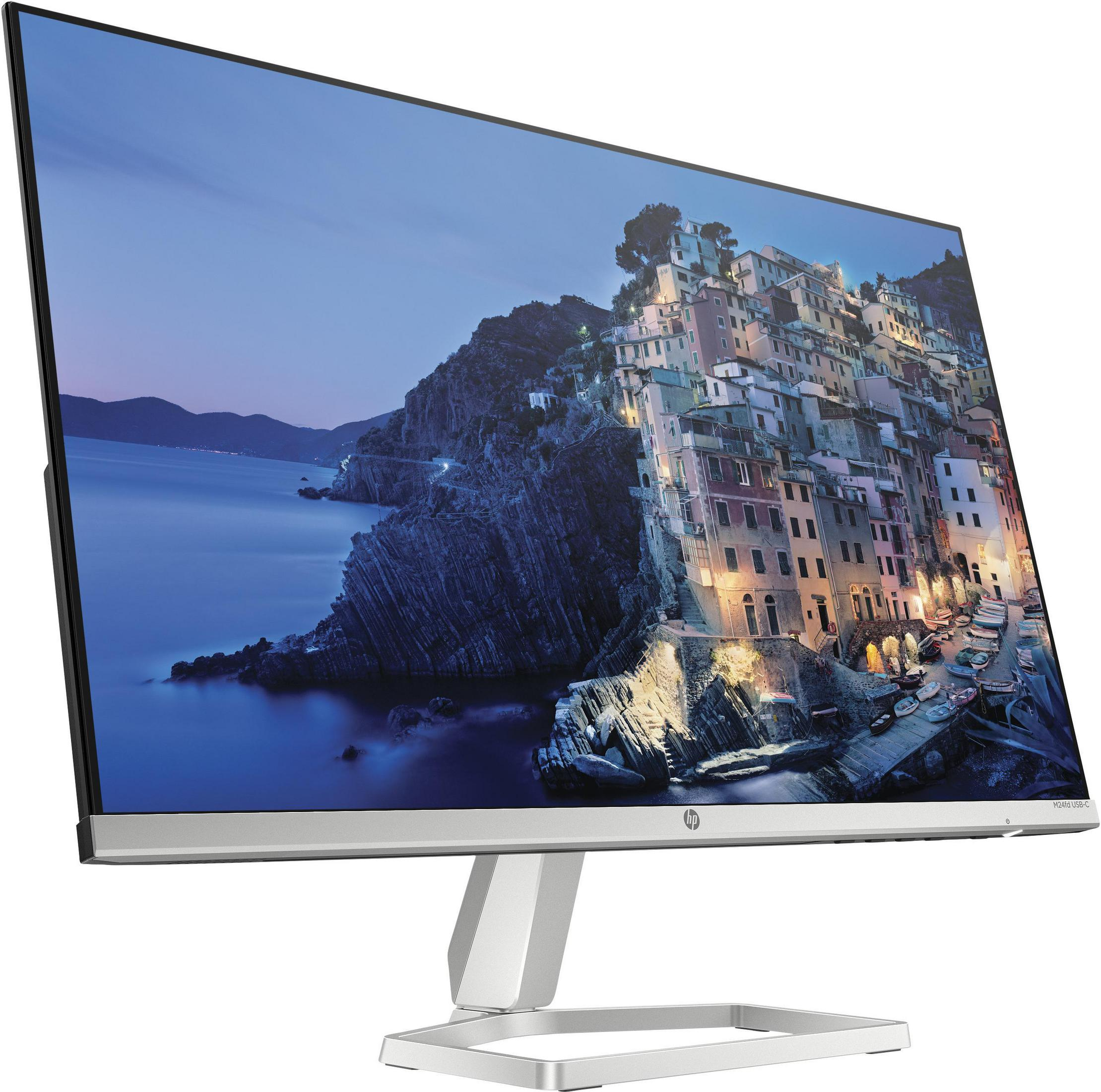 Monitor del computer argentato che mostra una città costiera al crepuscolo. Ha un supporto e una cornice argentati.