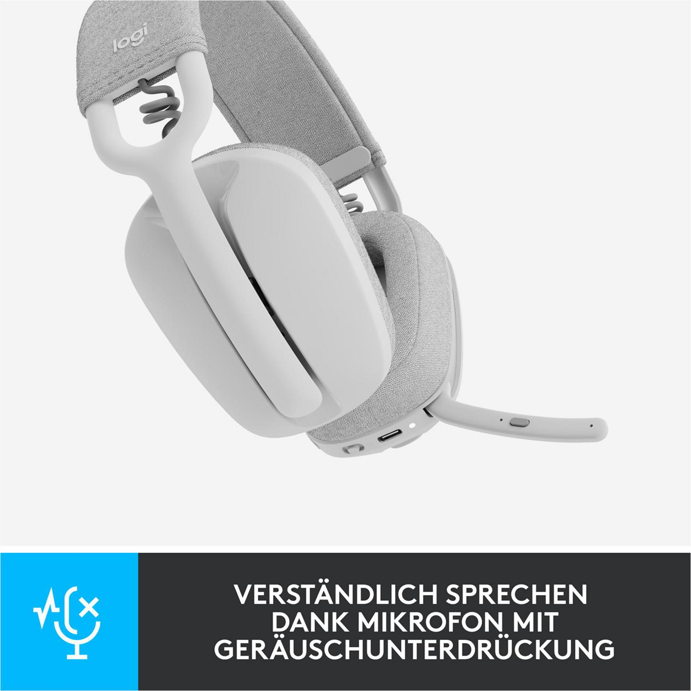 Białe słuchawki z mikrofonem i niemieckim tekstem.