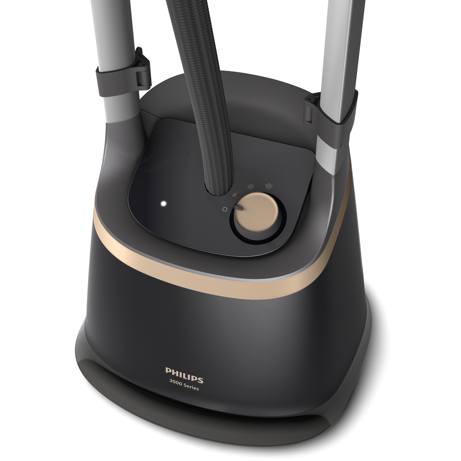 Black and gold Philips garment steamer. A light on the front indicates it is on. Modern design.