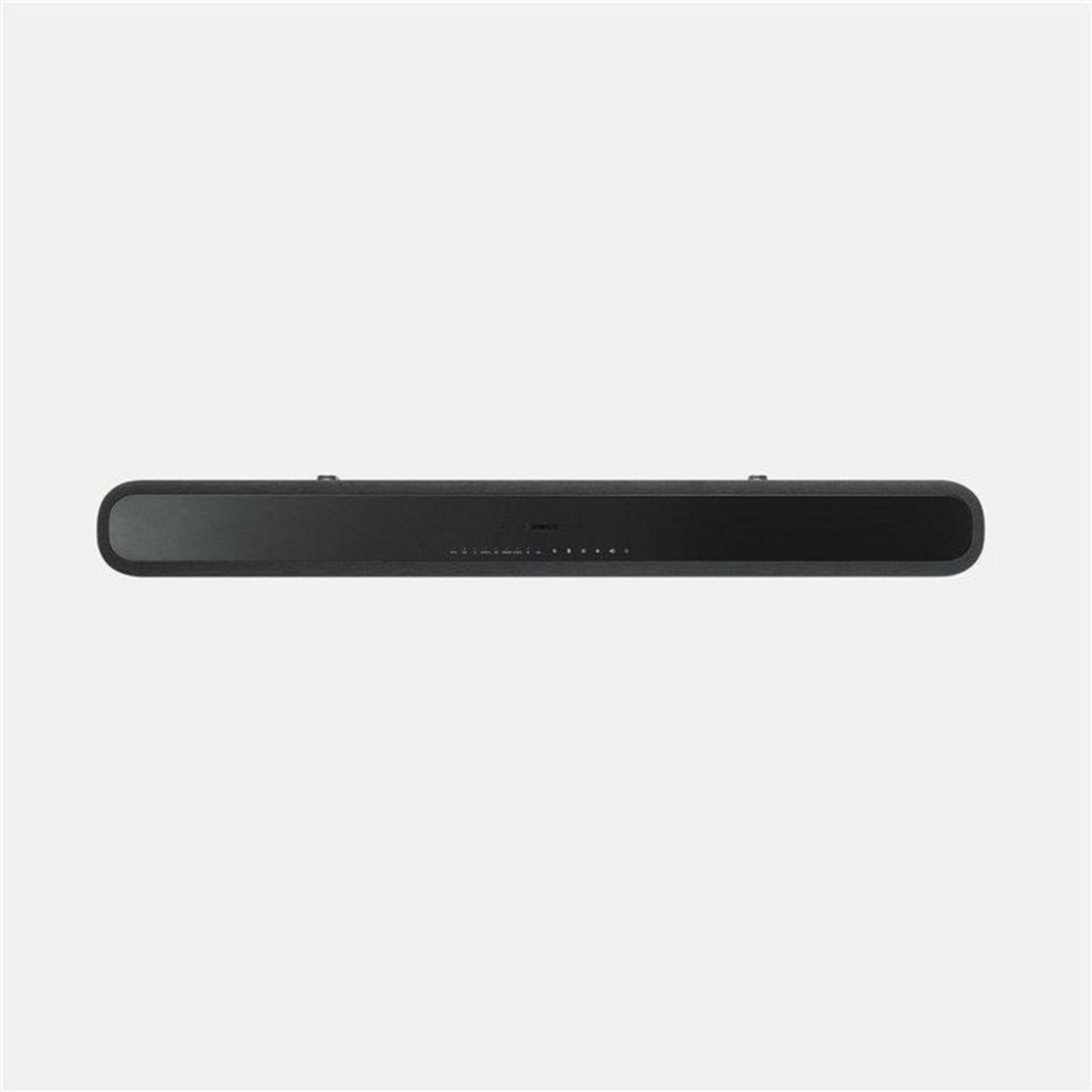 Barre de son noire sur fond blanc, forme rectangulaire, design minimaliste.