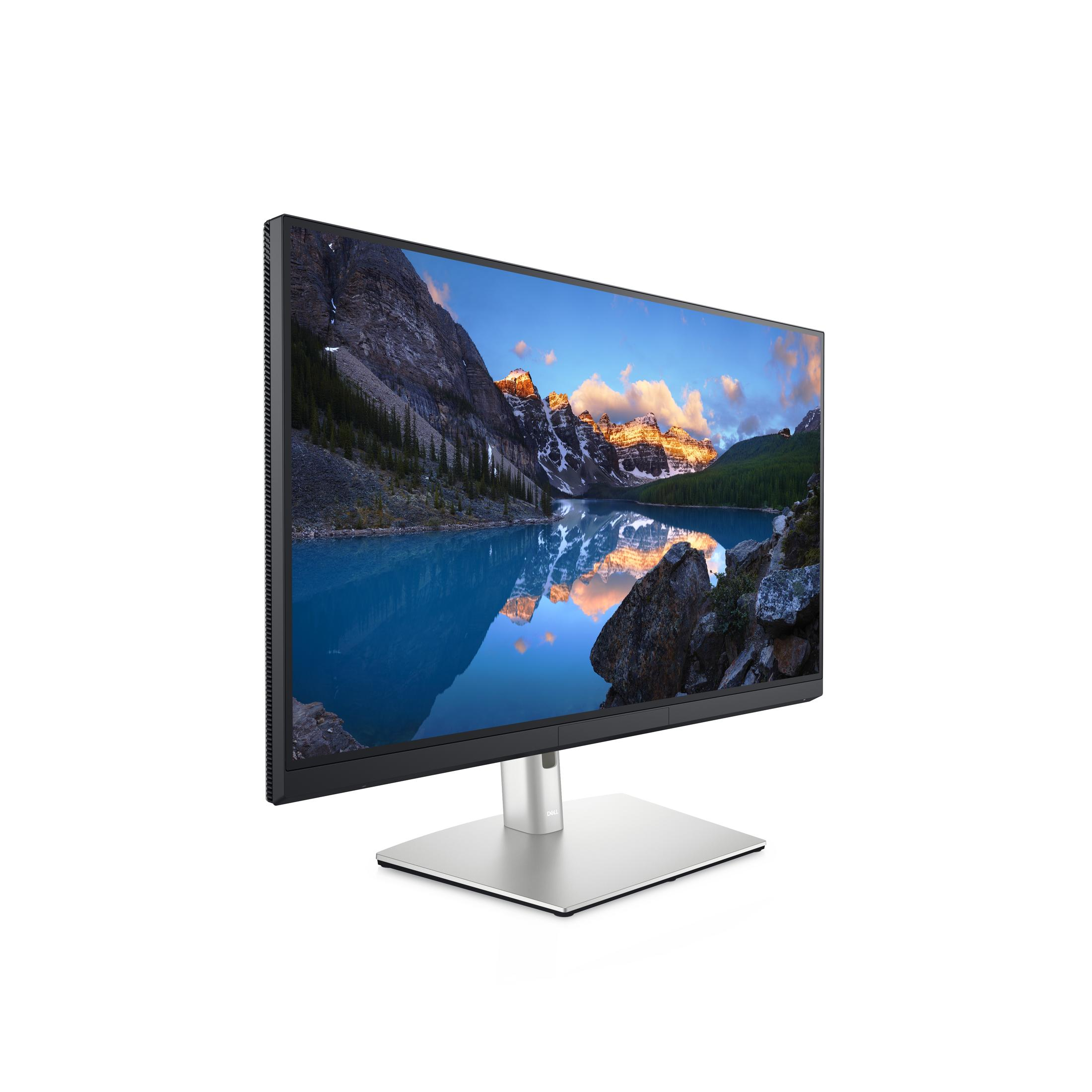 Monitor mit Landschaftsszene, silberner Ständer, weißer Hintergrund.