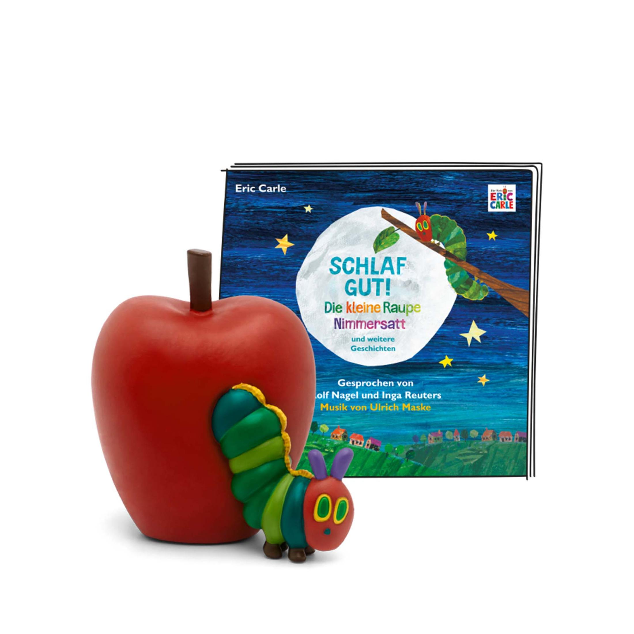 Ein roter Apfel mit einem grünen Raupenspielzeug und ein Buch mit einer Raupe auf dem Umschlag.