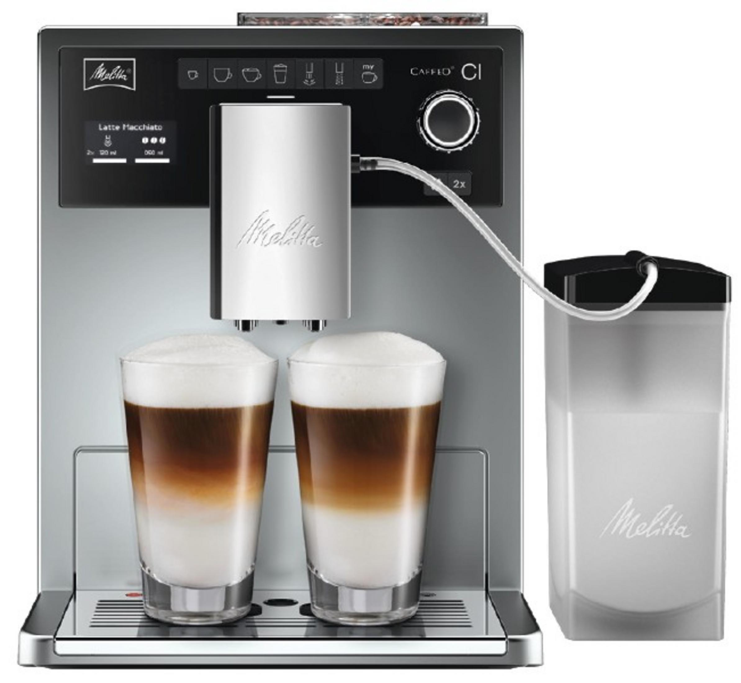 Una cafetera Melitta Caffeo CI con dos vasos de latte macchiato y un recipiente de leche.