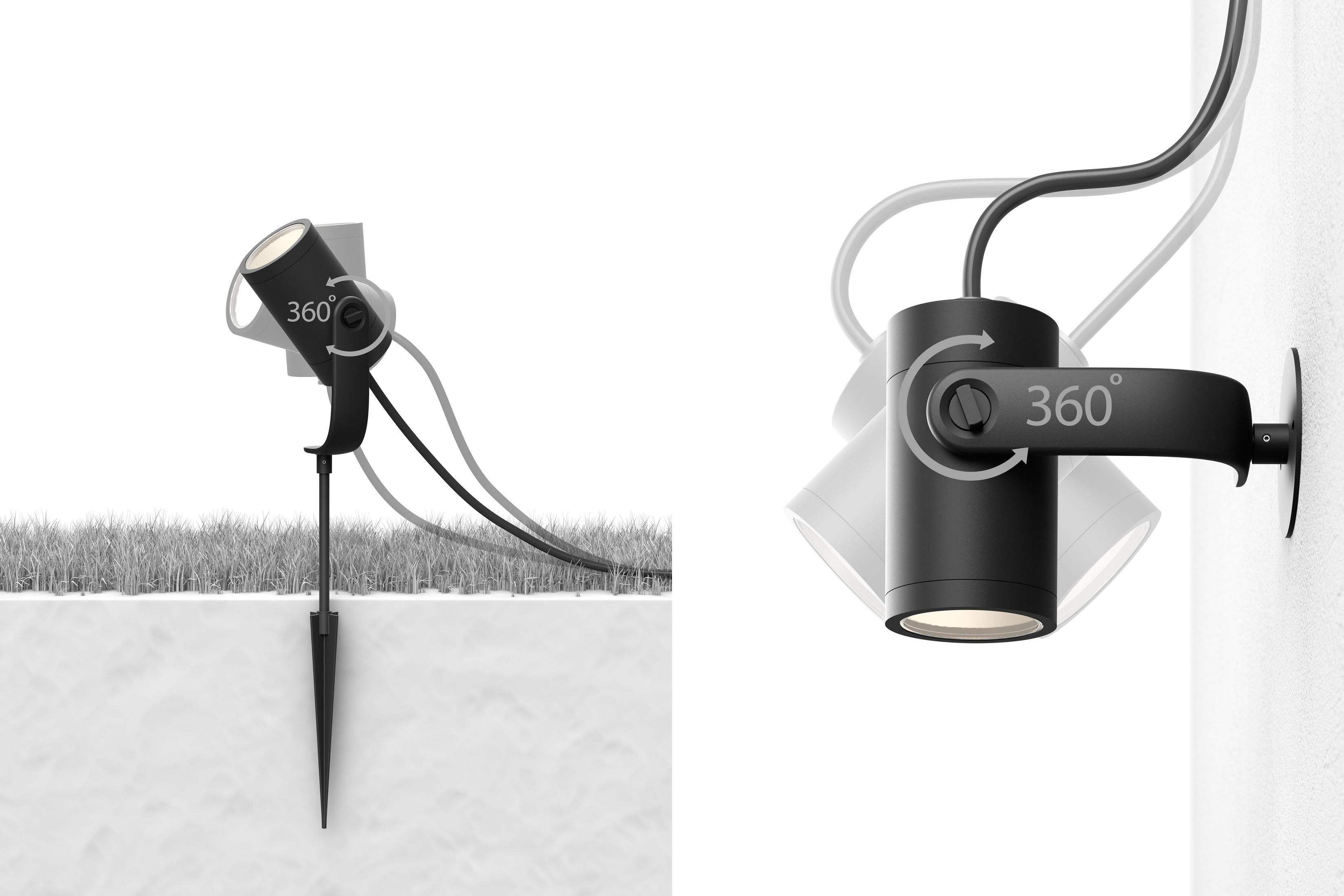 Czarny reflektor z palikiem w ziemi. Reflektor jest regulowany i może być zamontowany.