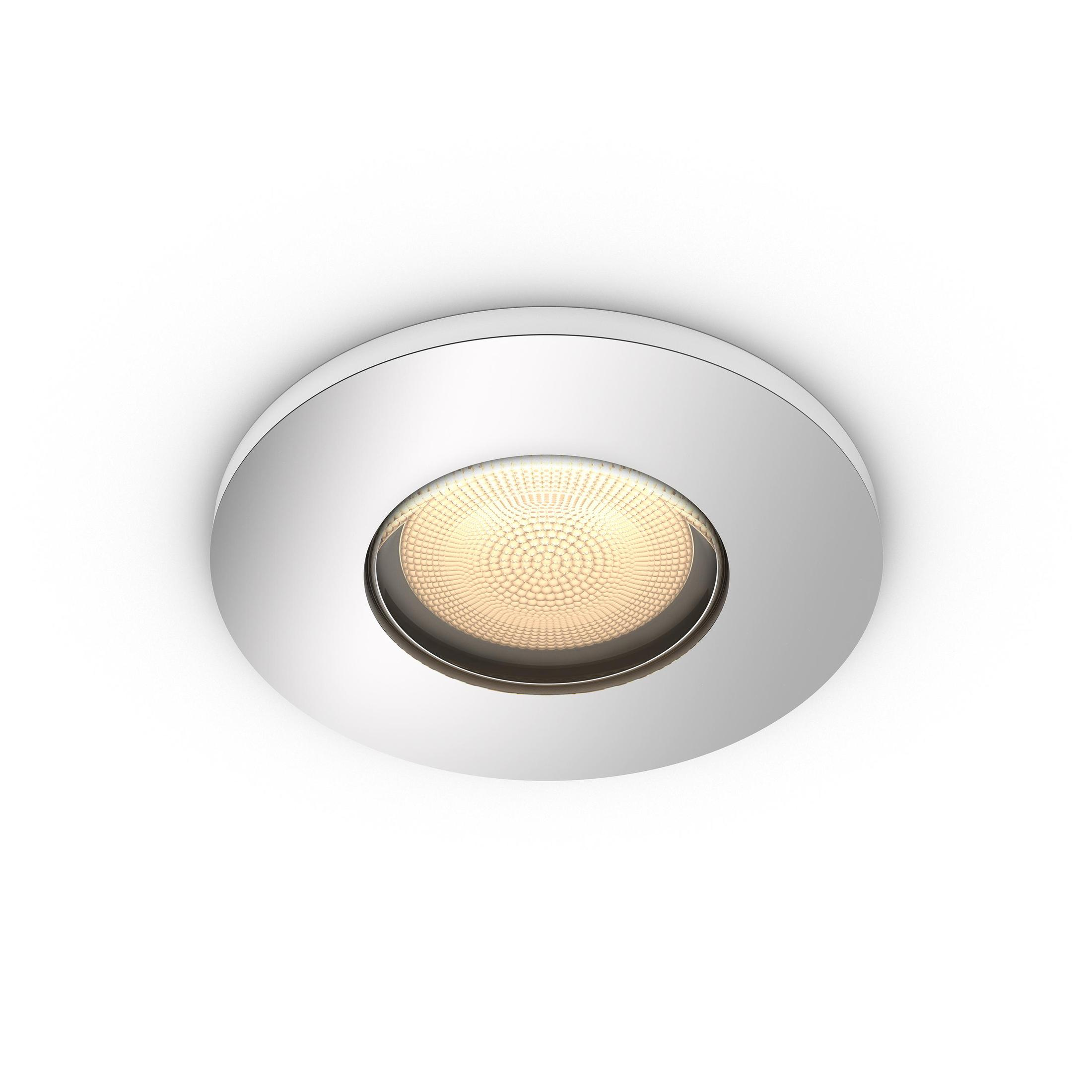 Un foco empotrado blanco con una fuente de luz amarilla brillante en un techo blanco.
