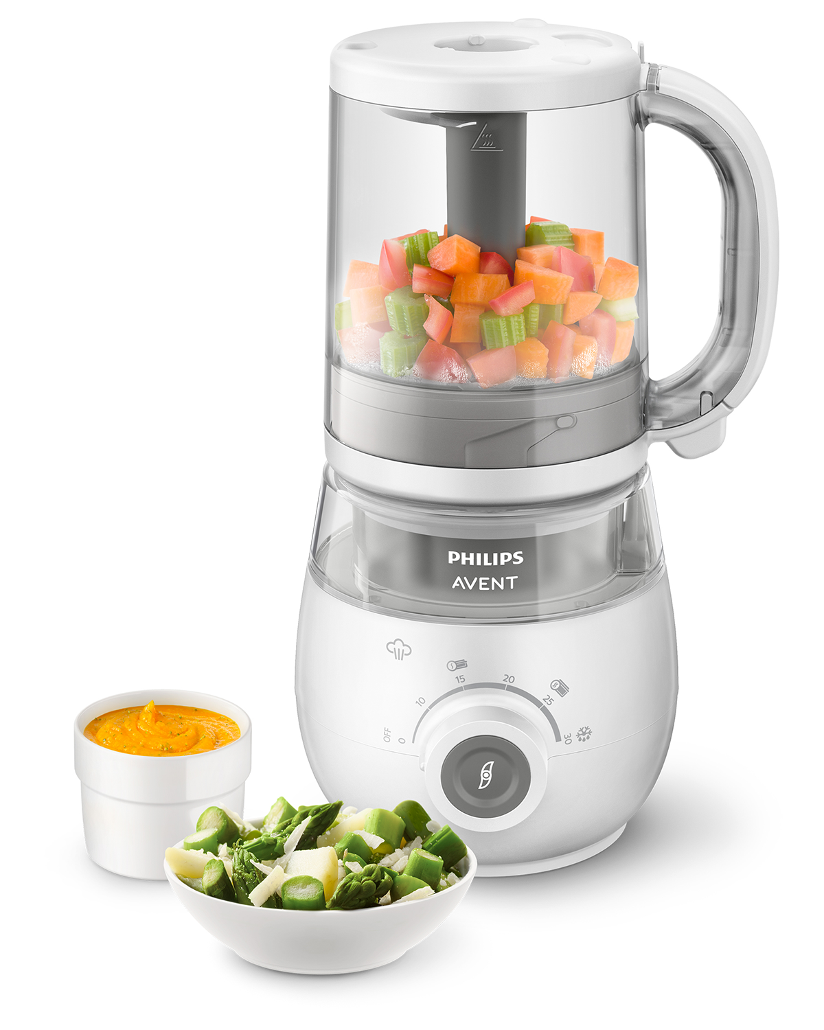 Weißer Philips Avent Babykostzubereiter. Gemüse in Schalen. Ein Behälter mit Püree.
