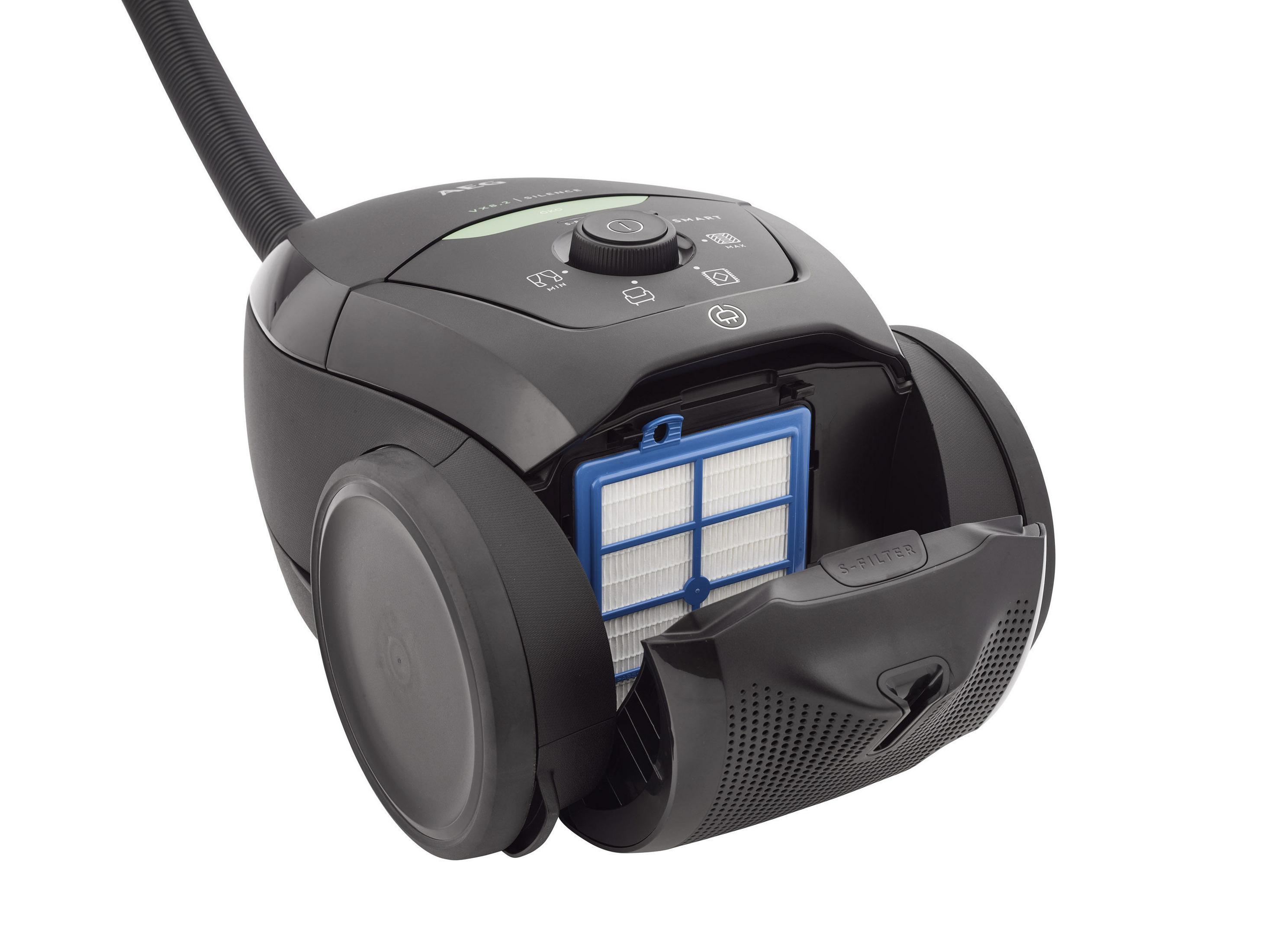 Czarny odkurzacz z otwartą komorą filtra, pokazujący filtr.