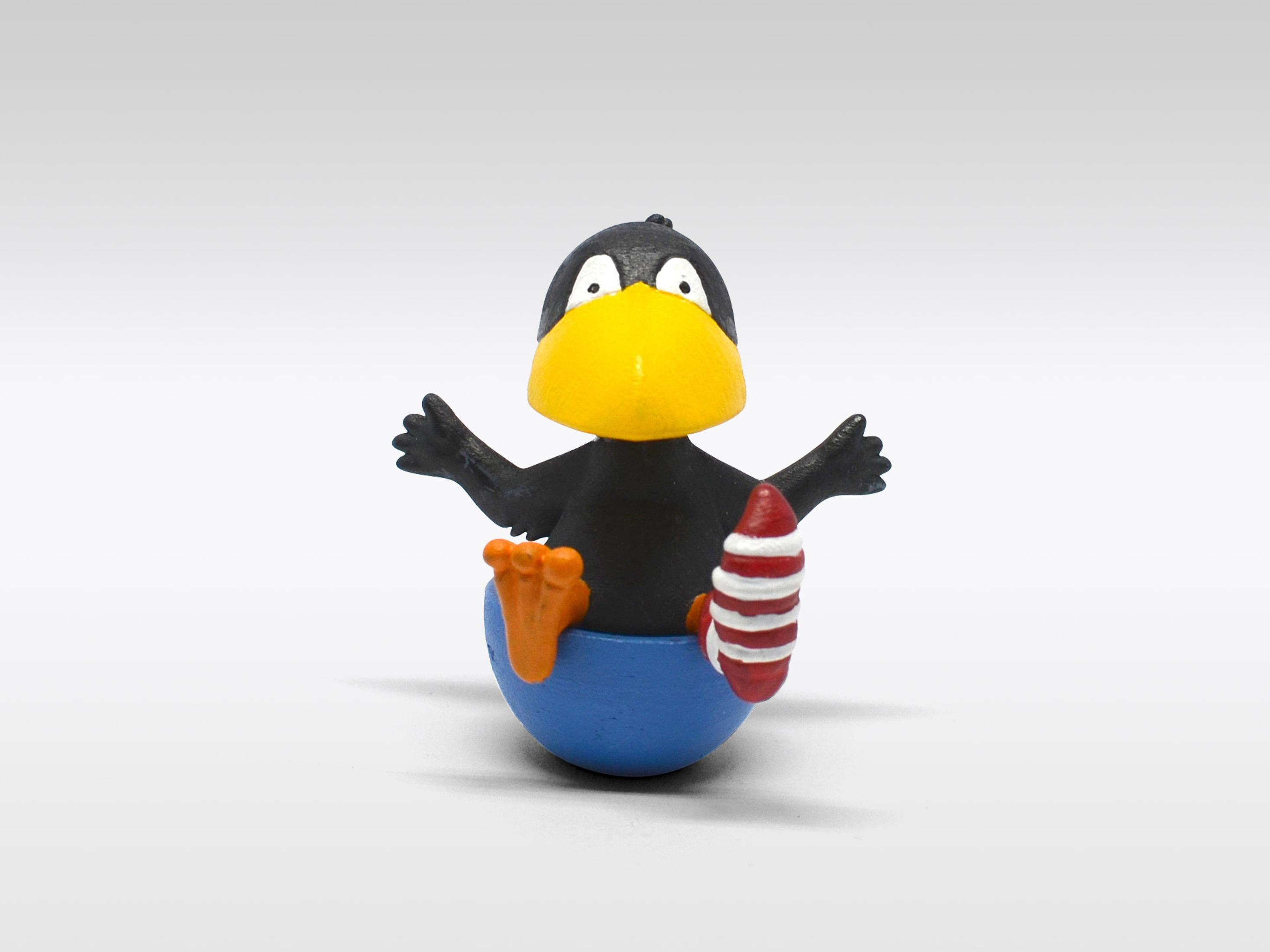 Ein Cartoon-Vogel mit gelbem Schnabel und blauem, eiförmigem Sockel.