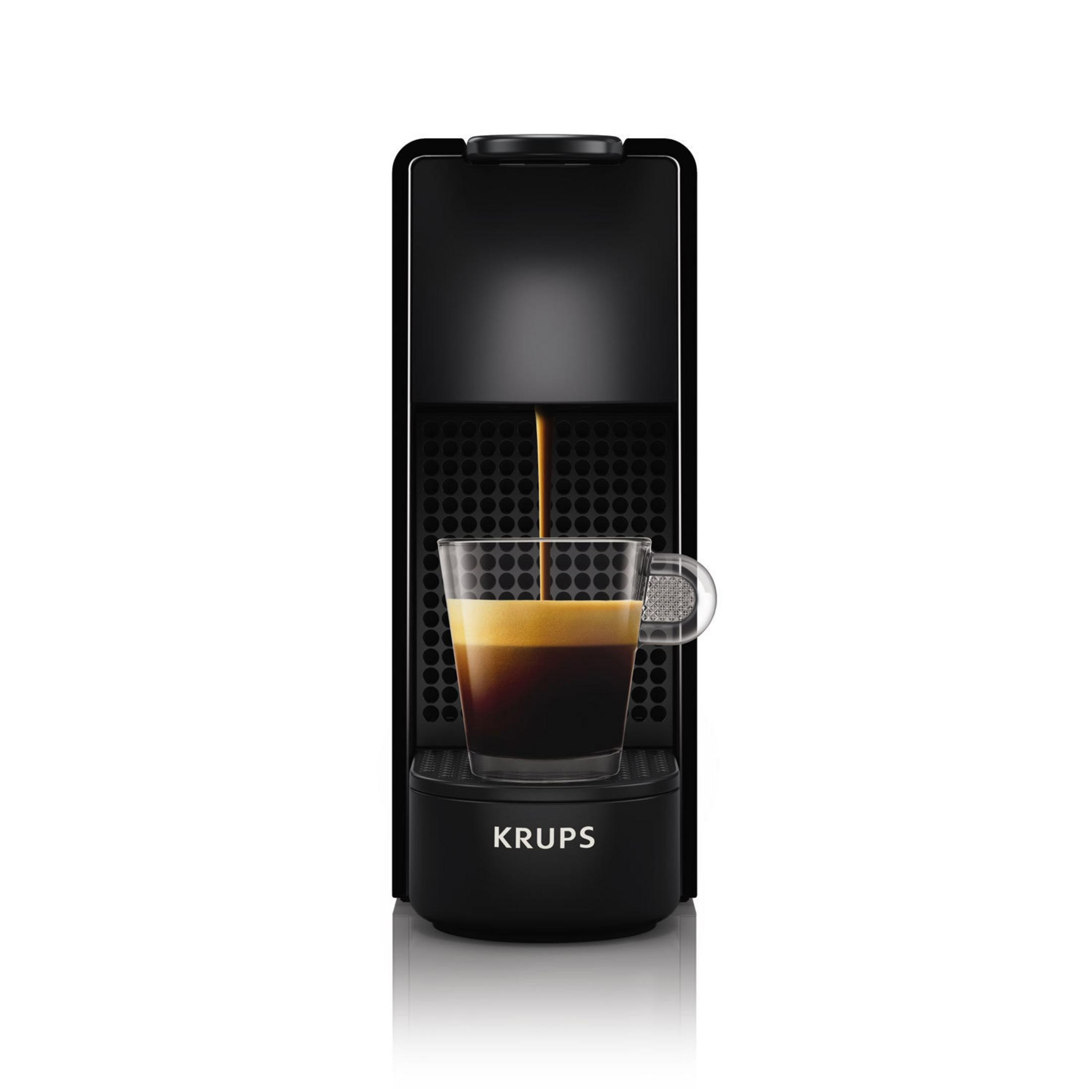 Eine schwarze Kaffeemaschine mit einer Glastasse, die Kaffee ausgießt.