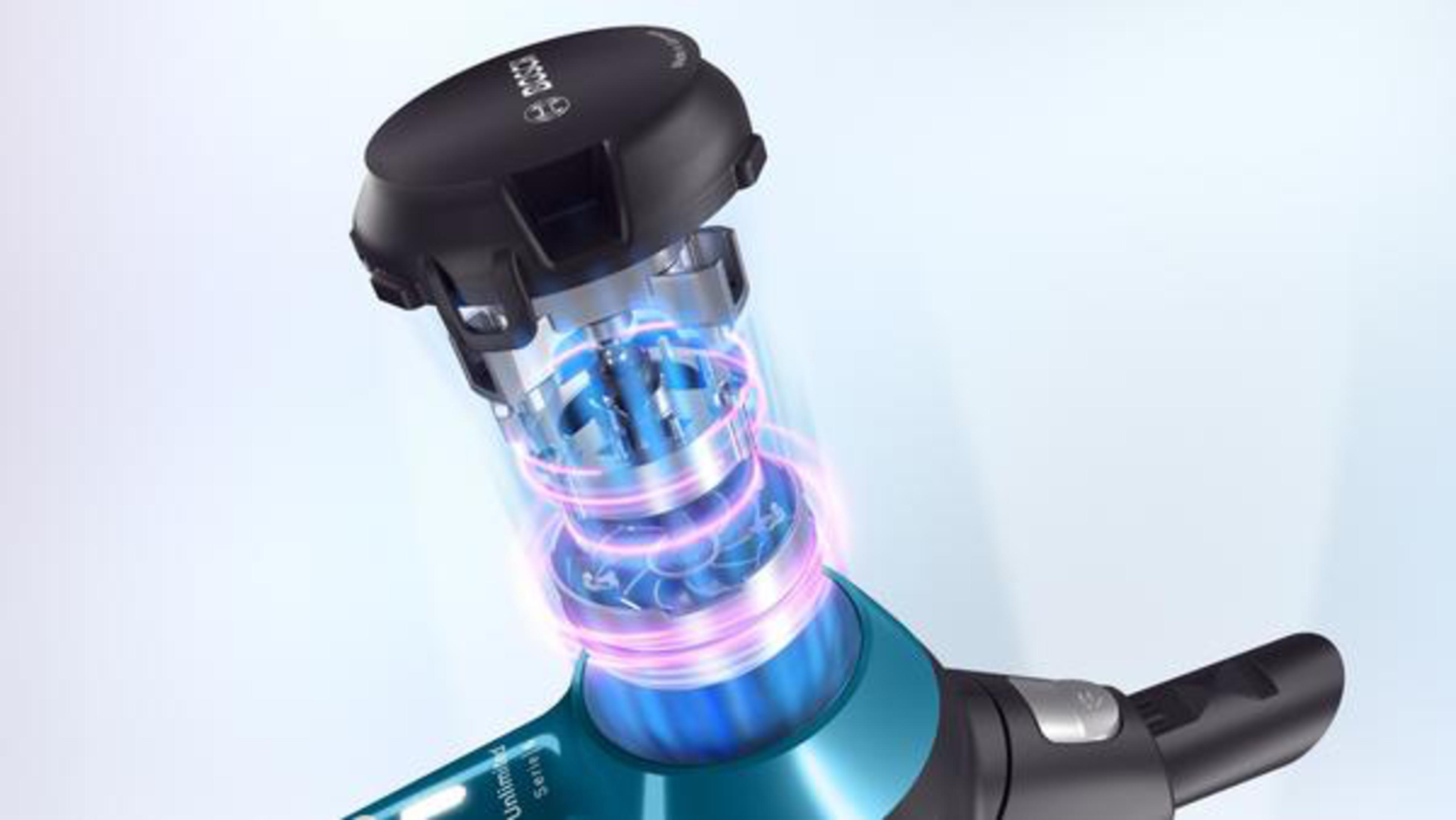 Componente de aspiradora con mecanismos internos visibles, iluminado con luces moradas y azules.
