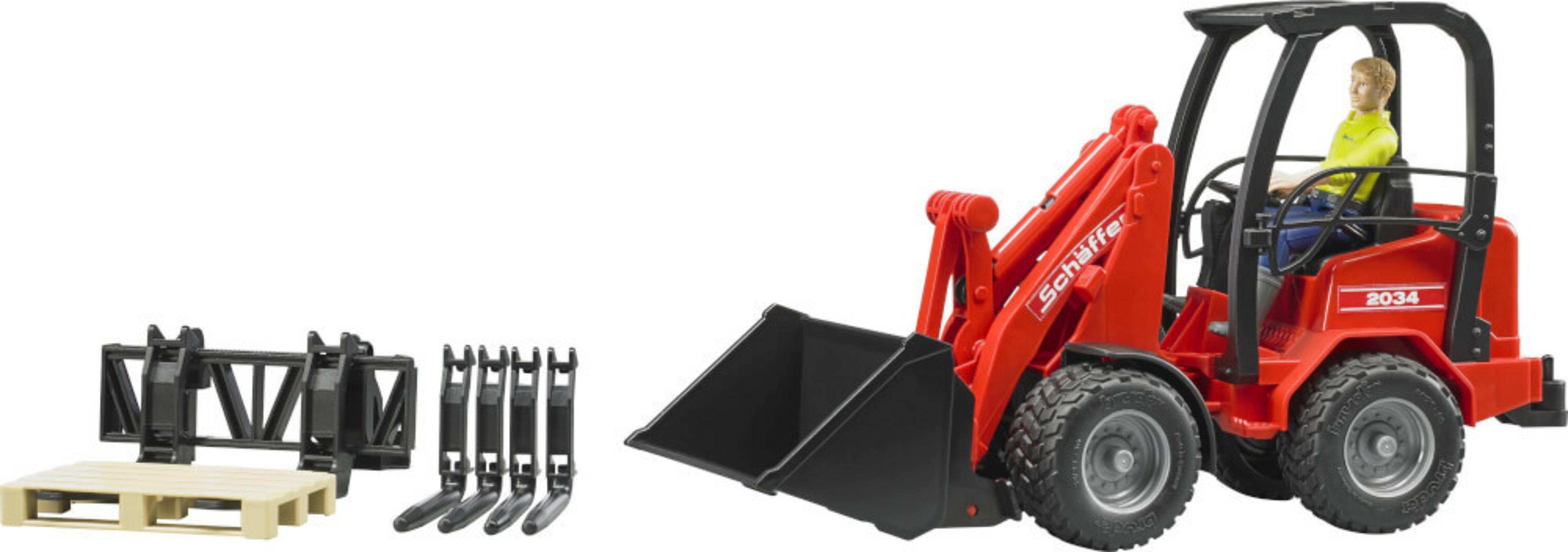 Czerwona zabawka-ładowarka czołowa z odłączanymi narzędziami i małą figurką na siedzeniu.