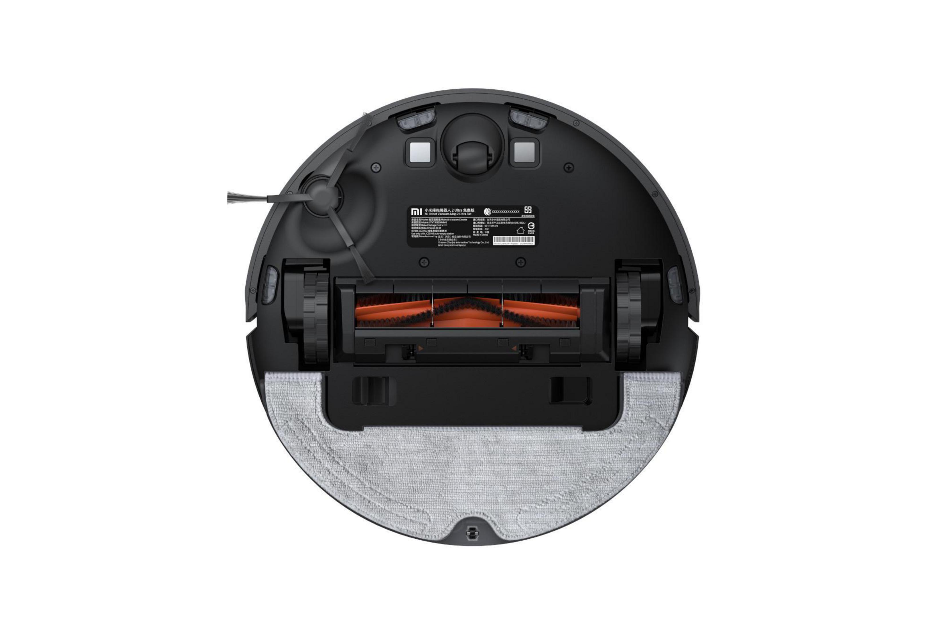 Robot aspirador, vista inferior. Negro con cepillo naranja.