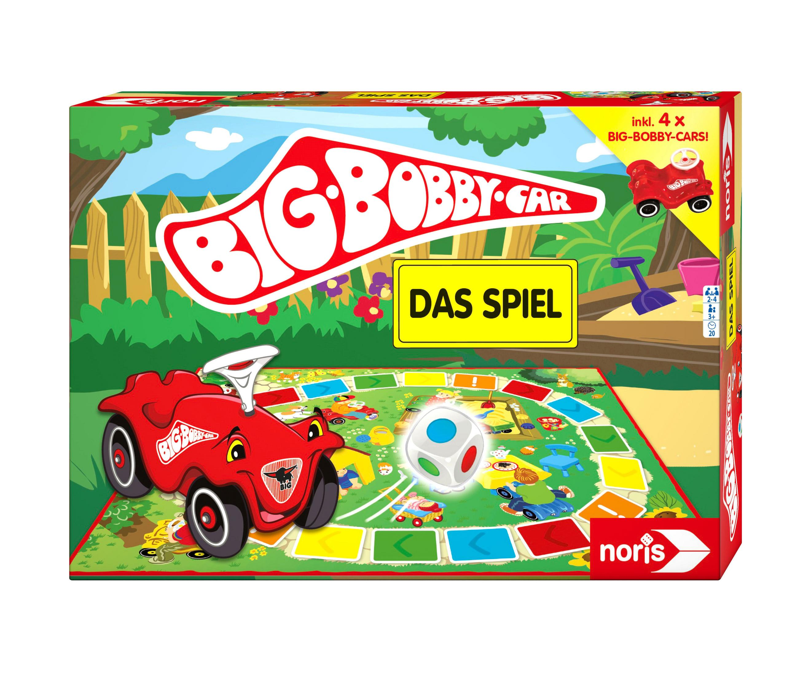 Big Bobby Car Spielbox. Ein rotes Auto auf dem Brett. Ein Würfel und Spielzeugwerkzeuge. Grüner Rasen.