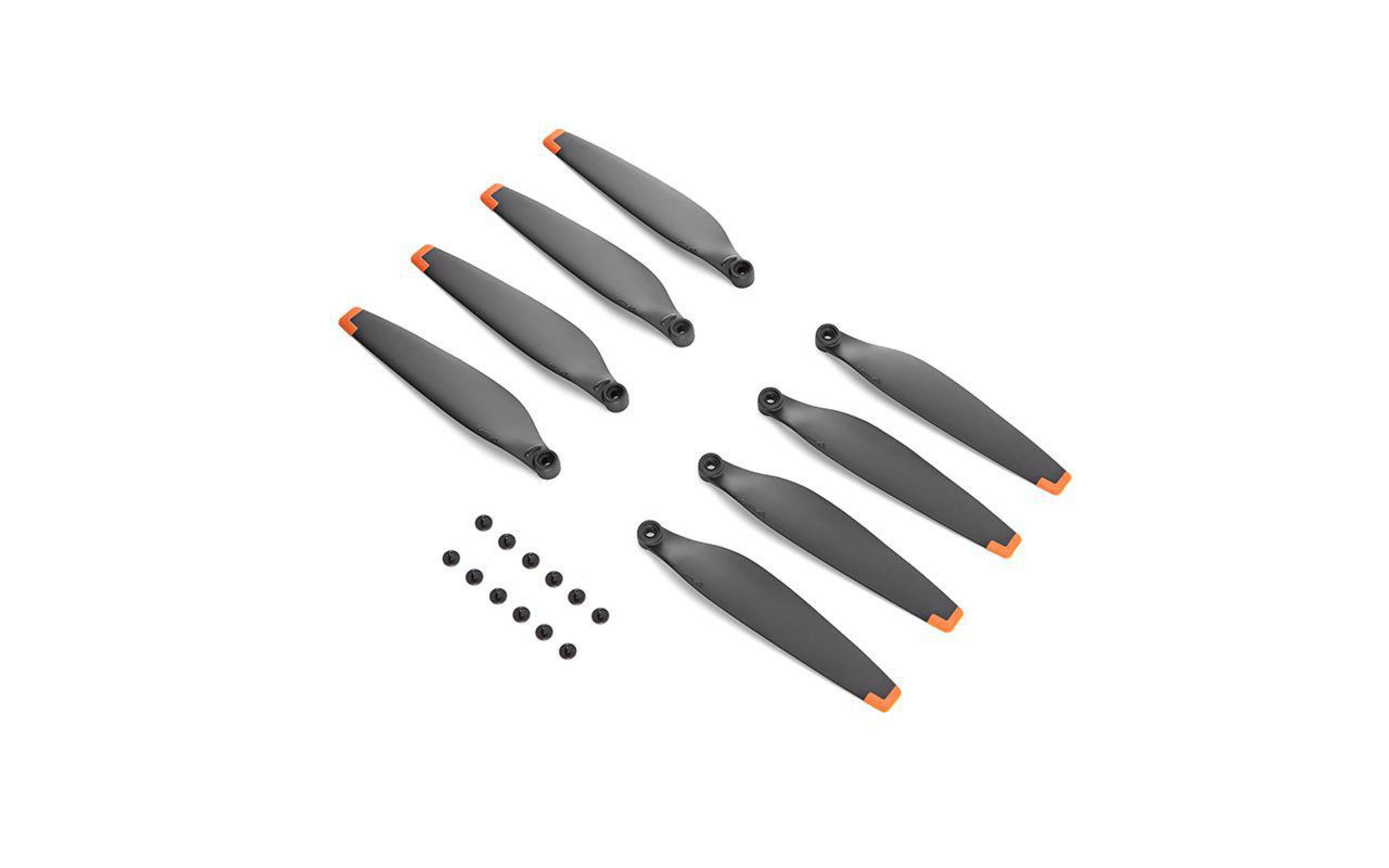 Satz Drohnenpropeller mit orangenen Spitzen und kleinen schwarzen Schrauben auf Weiß.