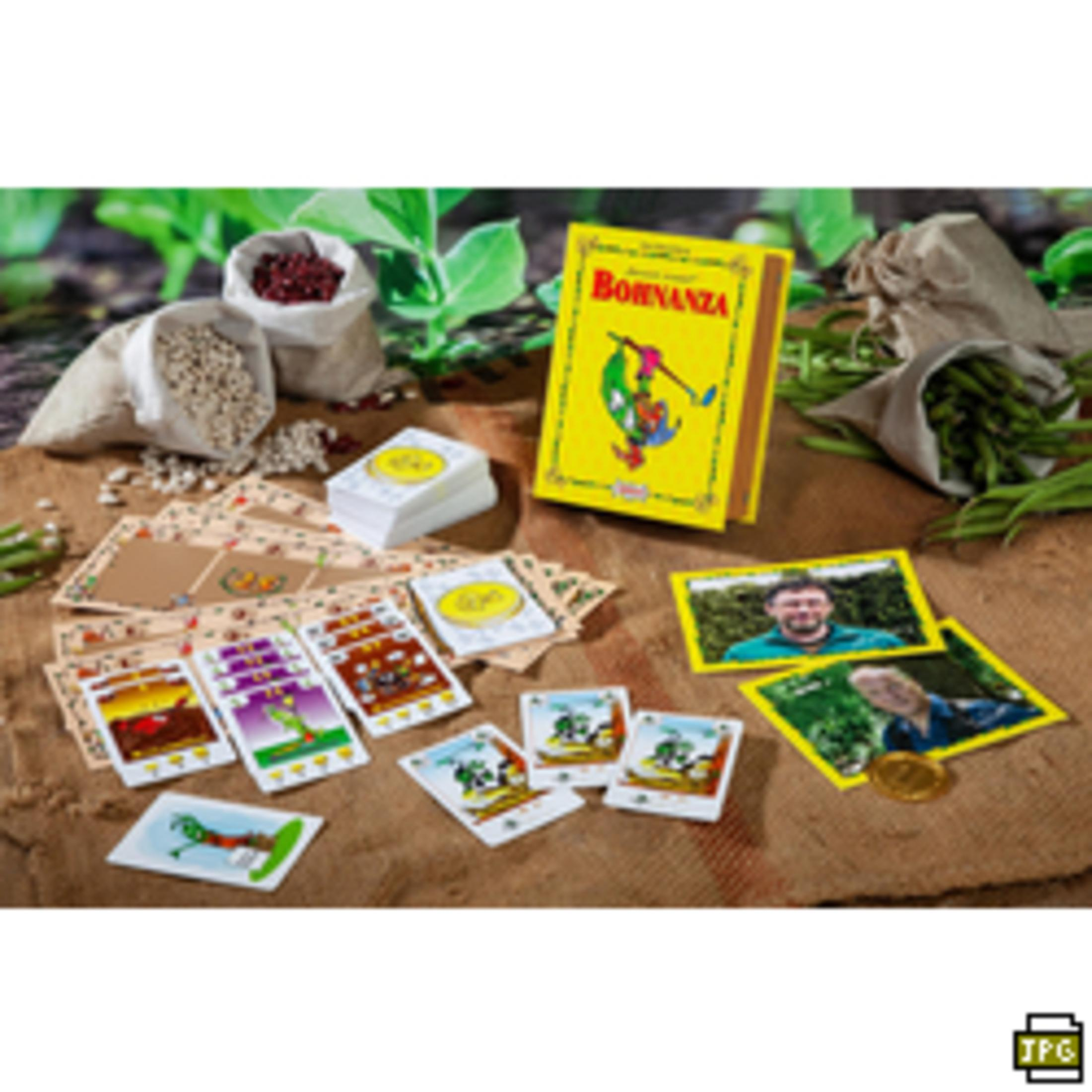Le jeu de société Bonanza, avec diverses cartes et éléments de jeu sur une table.