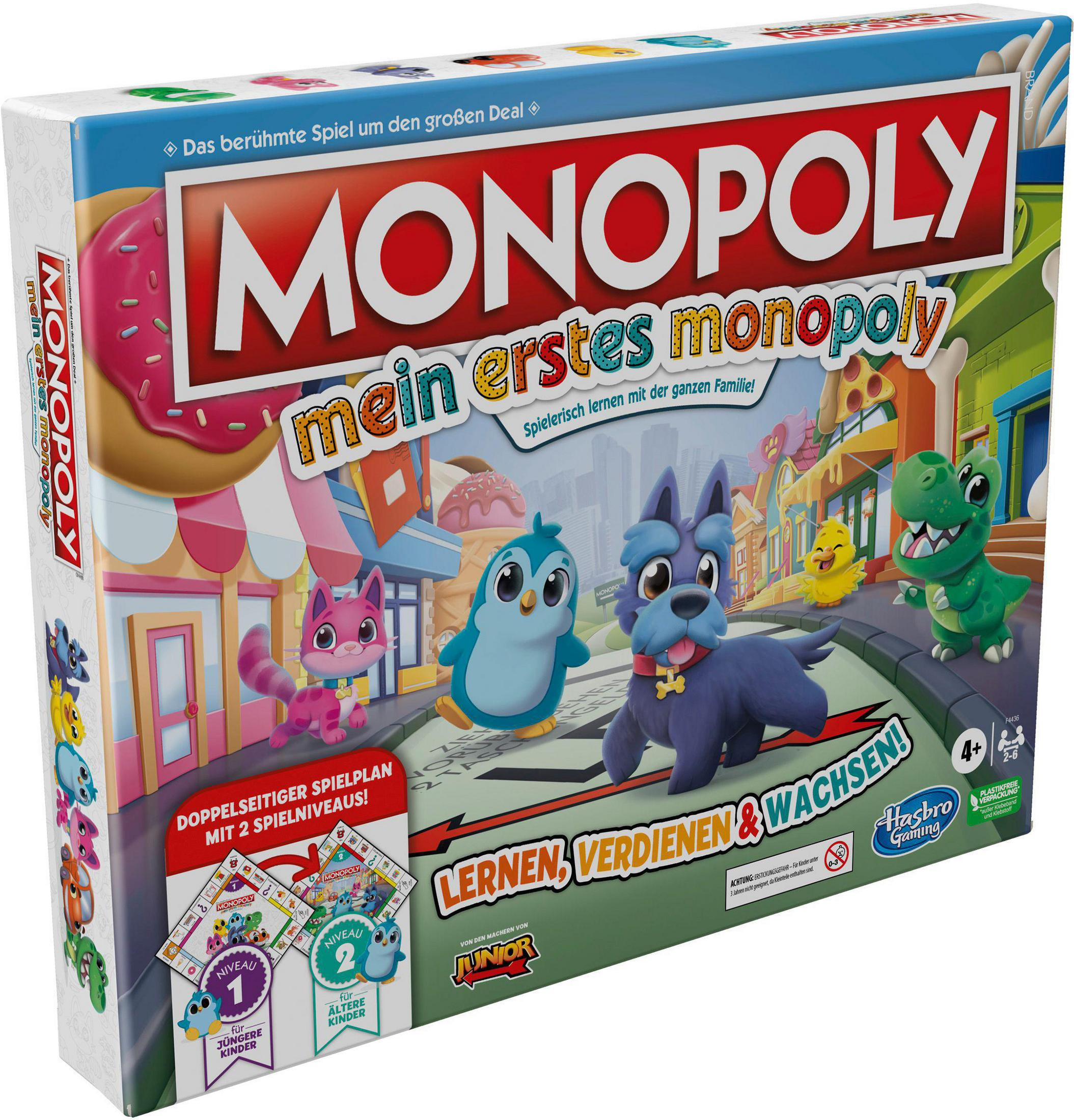 Eine Monopoly Mein erstes Monopoly Box mit Zeichentrickhunden und anderen Figuren. Die Box ist bunt.