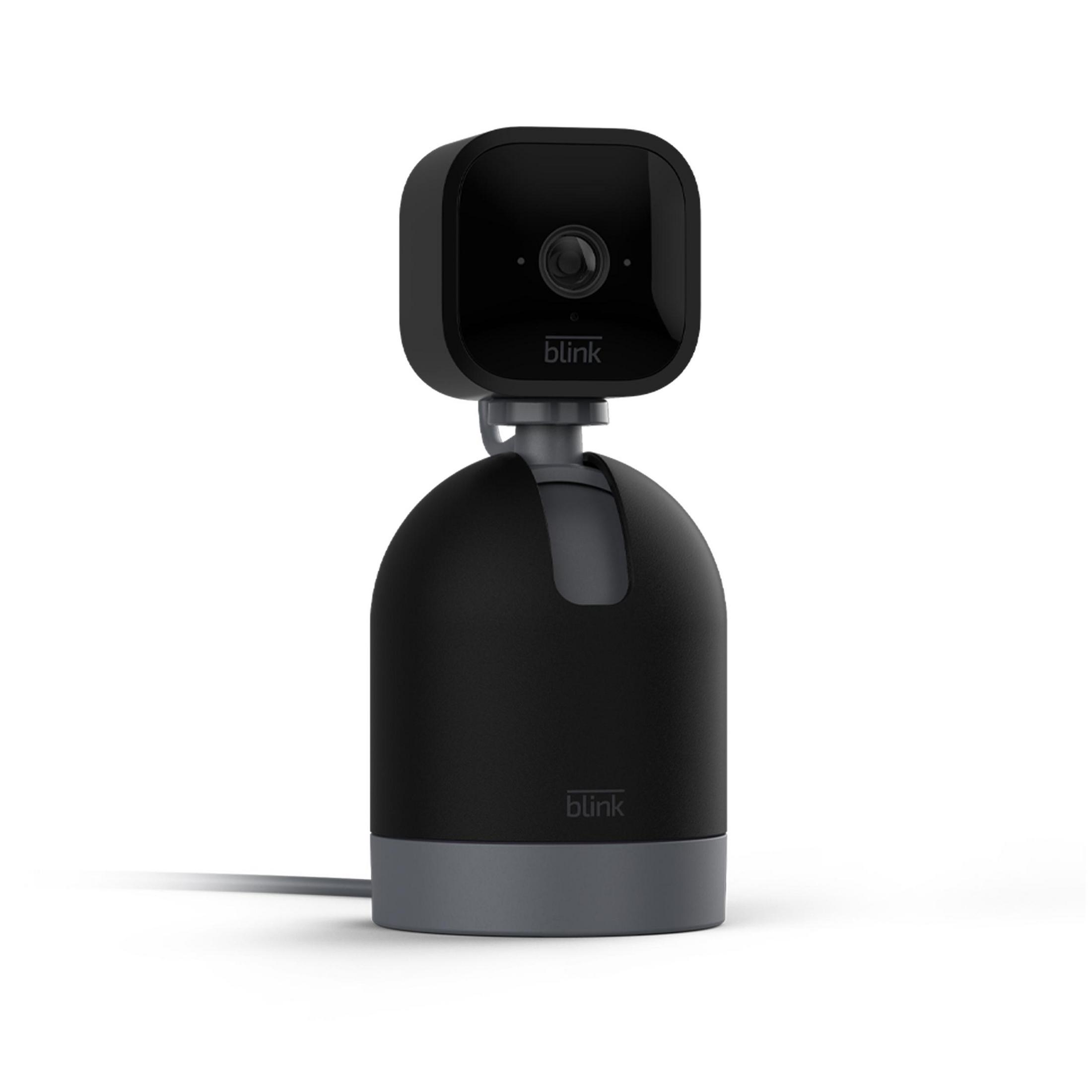 Czarna kamera bezpieczeństwa Blink na stojaku. Kamera ma obiektyw i znajduje się na białym tle.
