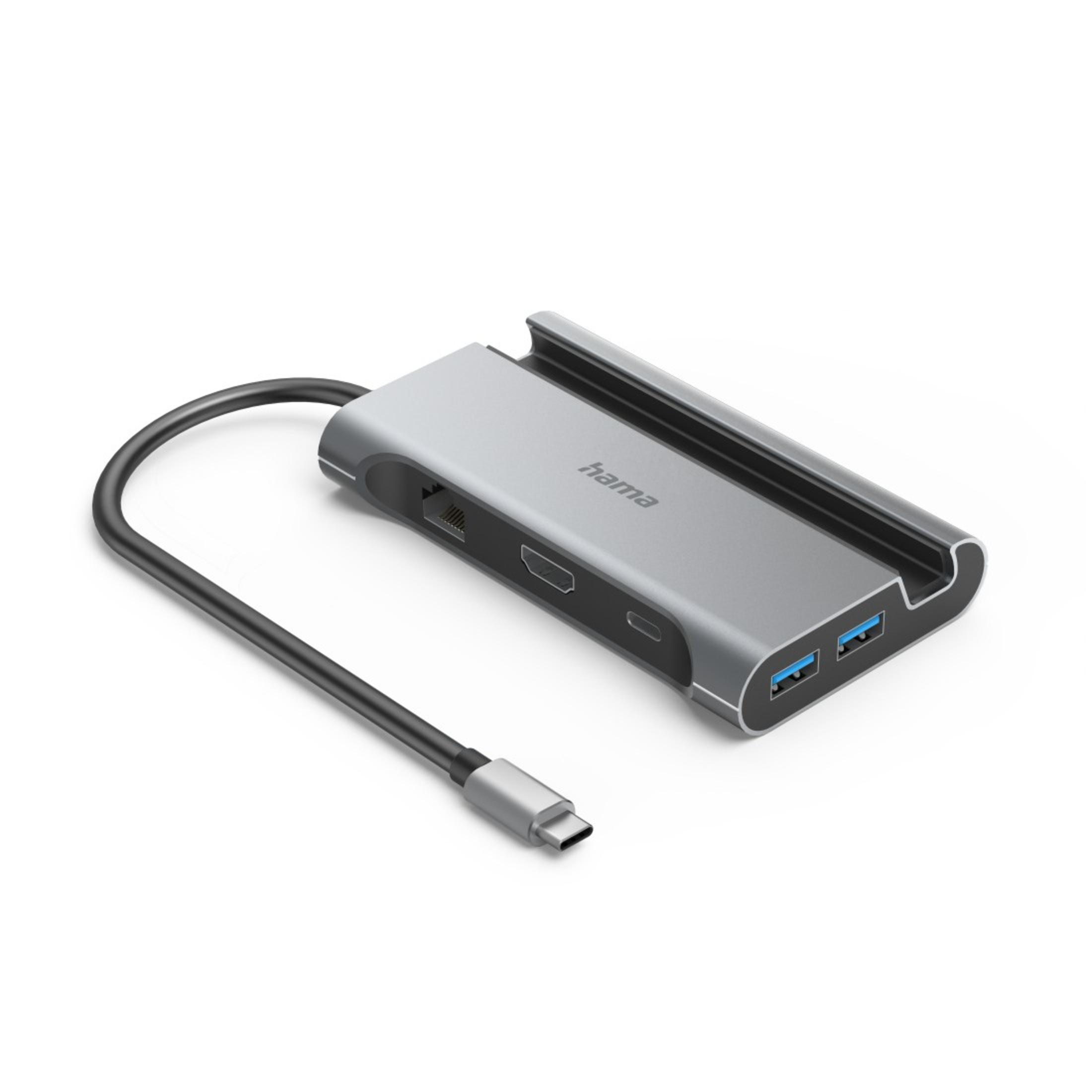 Silberner Hama USB-C Hub mit mehreren Anschlüssen und einem schwarzen Kabel. Isoliert auf Weiß.