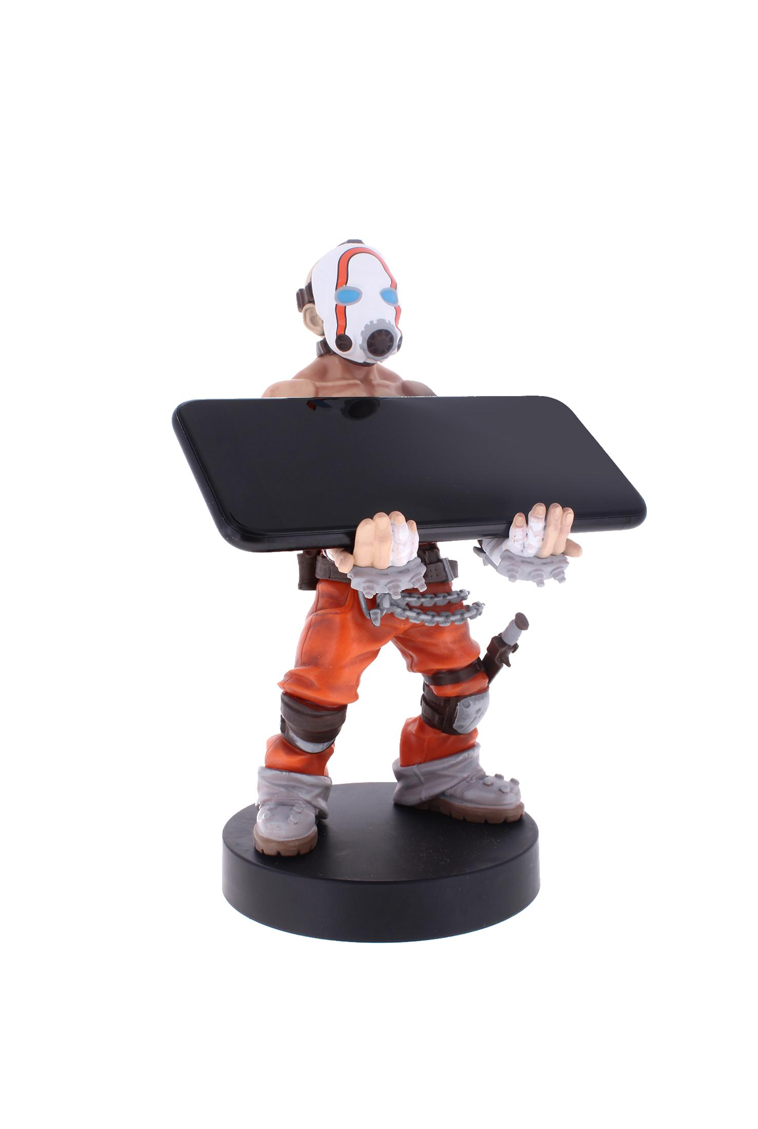 Una statuetta di un mostro che tiene un telefono nero. Il mostro ha artigli neri.