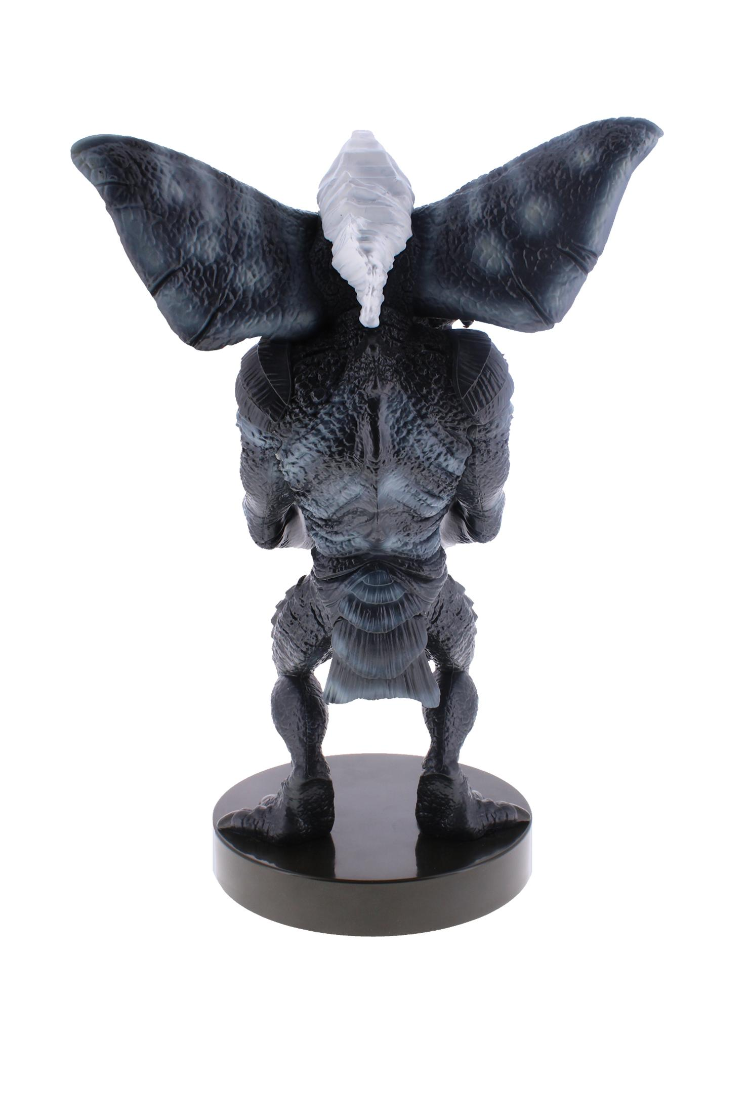 Una statua di Demogorgon, nera e grigia, con ali, su una base nera, isolata su bianco.