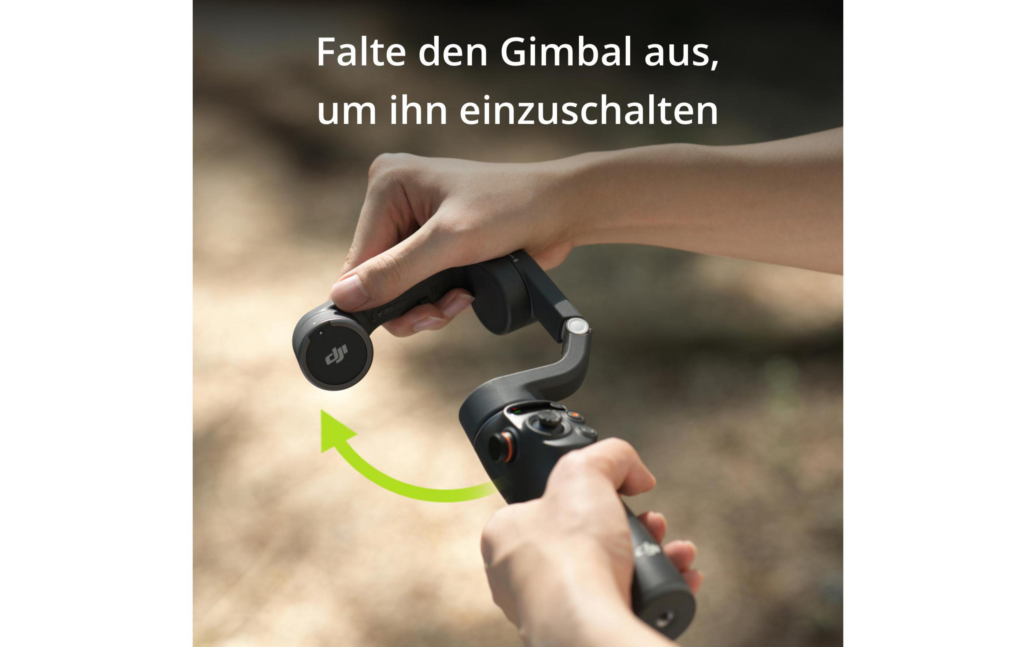 Dłonie trzymające gimbal, ze strzałką wskazującą na otwarcie do użycia.