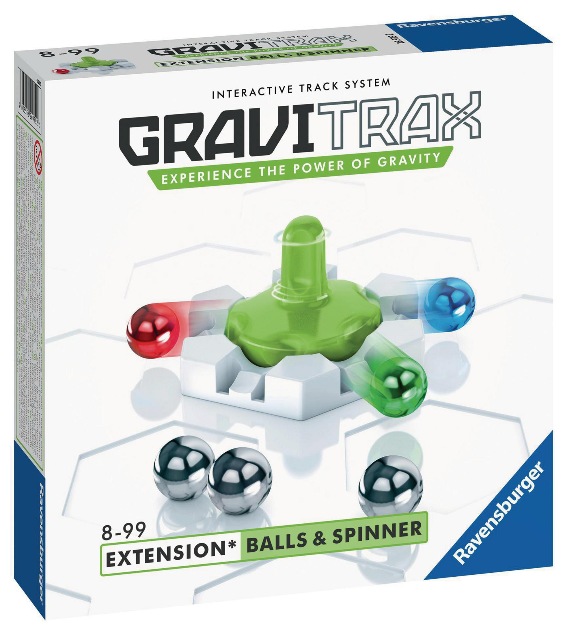 Gioco GraviTrax in scatola con pista, blocchi verdi e bianchi e sfere metalliche.