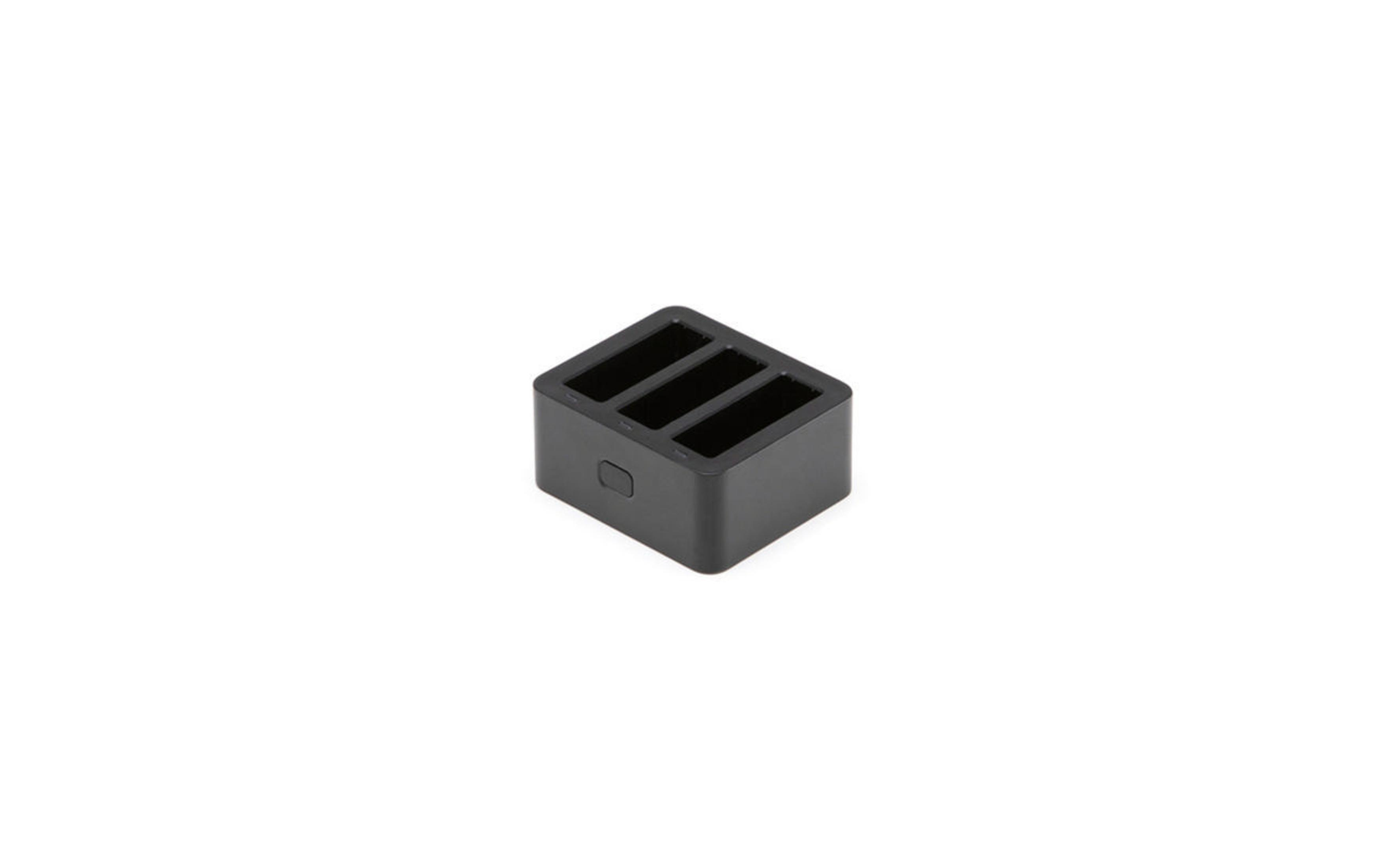 Un cargador GoPro negro en forma de cubo. Fondo blanco.