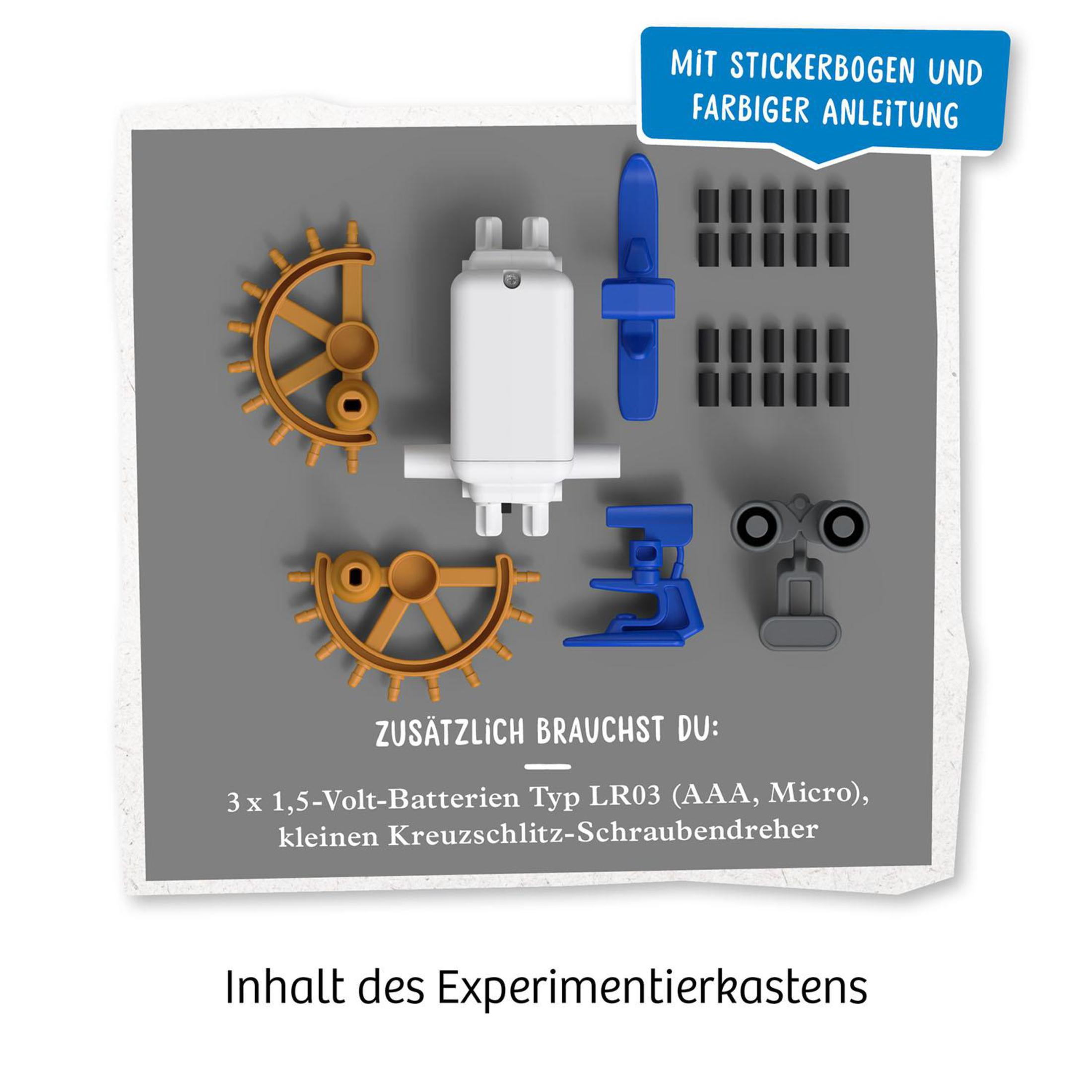 Contenu de la boîte d'un kit scientifique, comprend des engrenages, des vis et d'autres composants.