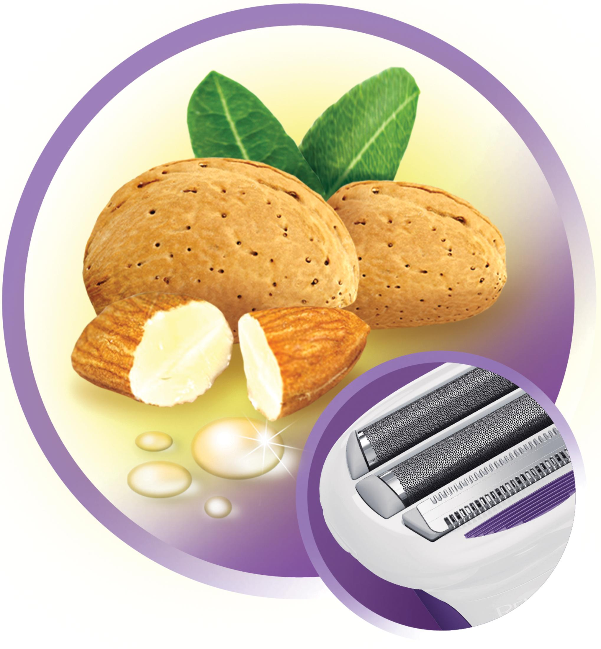 Zbliżenie na migdały, jeden przecięty na pół, z liśćmi i ostrzami maszynki do golenia w okręgu.