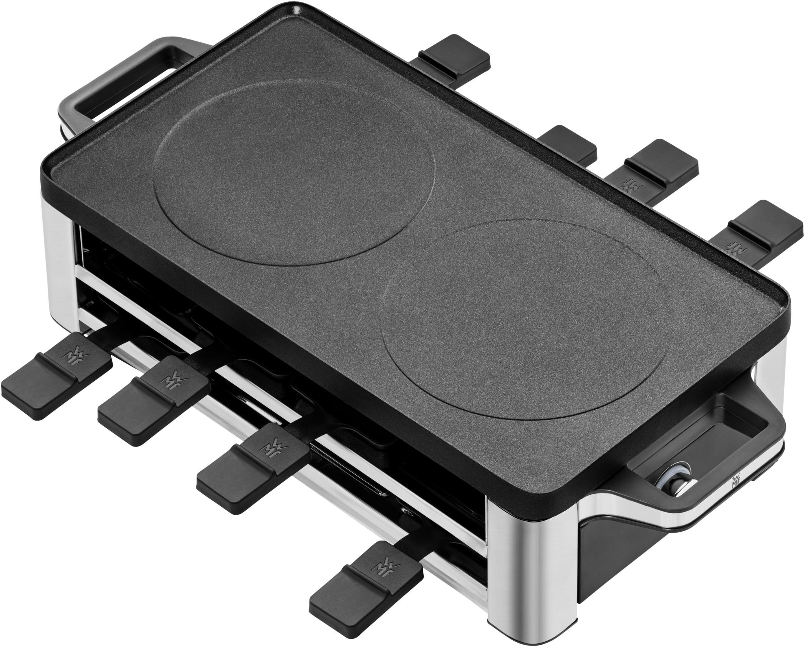 Czarny i srebrny grill do raclette. Posiada dwie powierzchnie do gotowania i kilka uchwytów na ser.