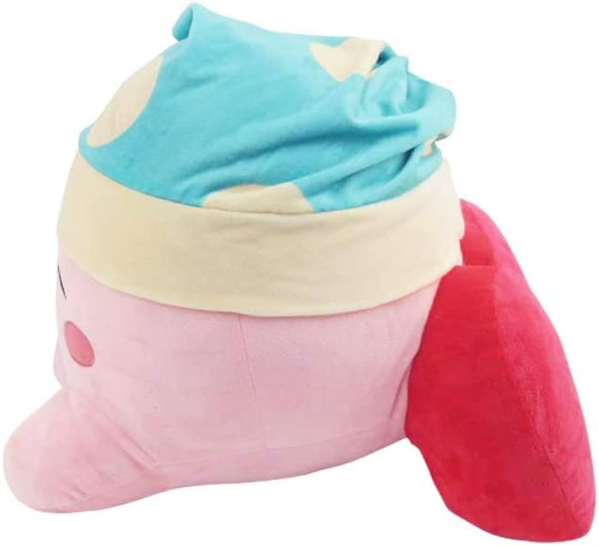 Eine rosa Plüschfigur mit einem blauen Sternenpyjamamütze, weiße Punkte.