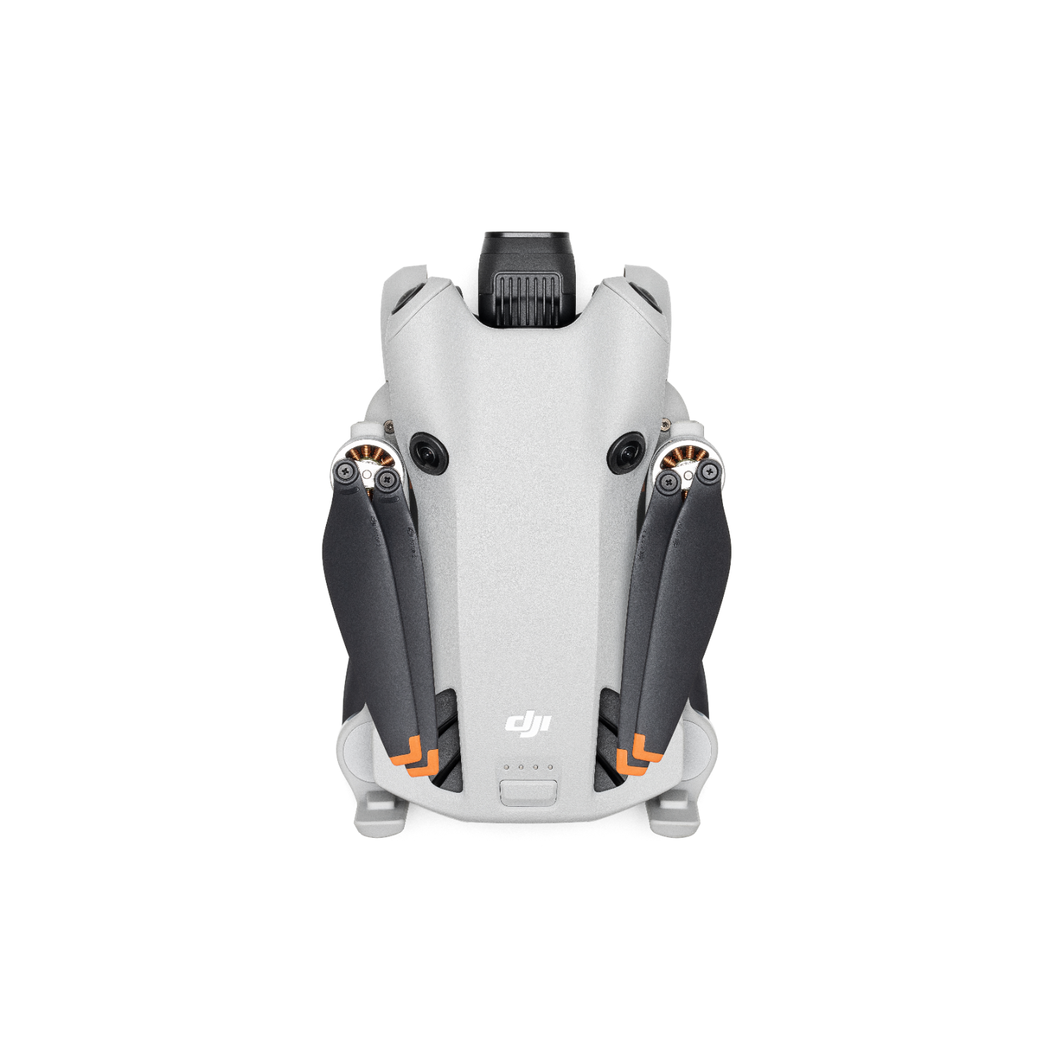 Dron DJI Mini 3, szary korpus z czarnymi śmigłami i pomarańczowymi akcentami, widok z góry.