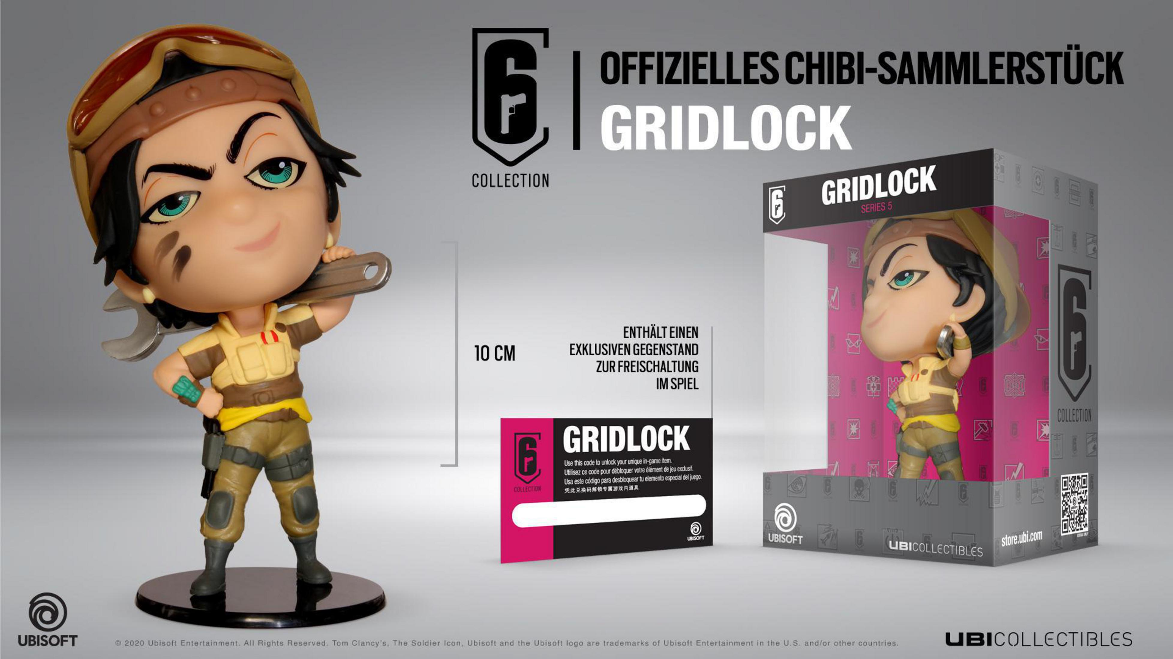 Figura chibi de Gridlock con caja, sosteniendo una llave. Texto en la caja 'OFFIZIELLES CHIBI-SAMMLERSTÜCK'.