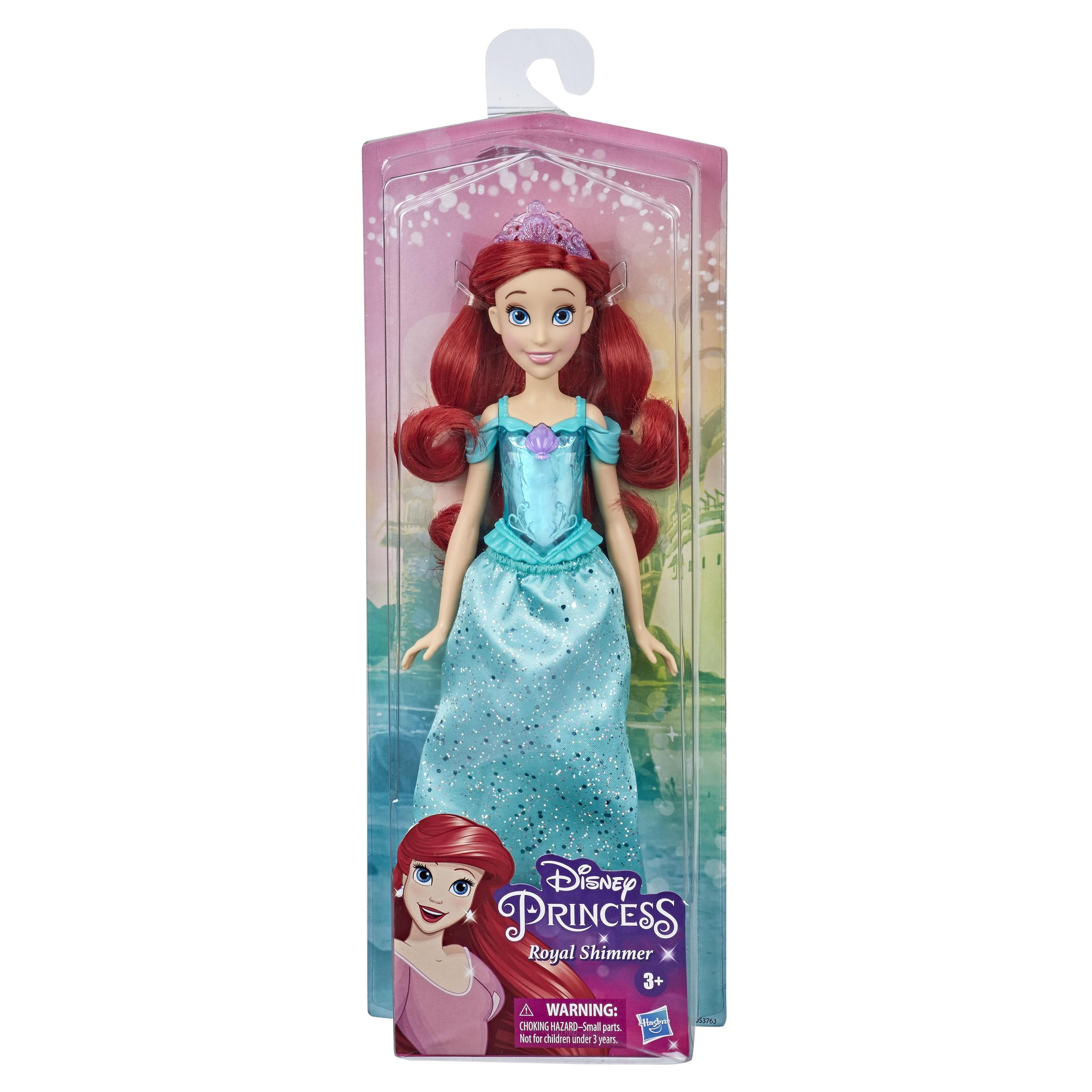 Bambola Ariel in una scatola. Ha capelli rossi, un vestito blu e una tiara viola.