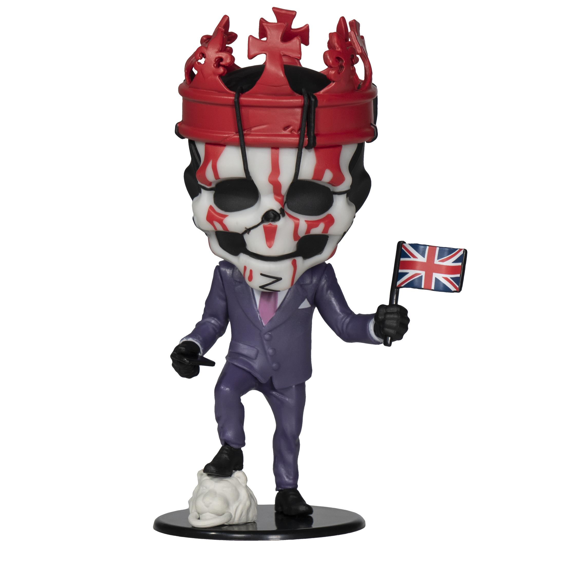 Figur einer schädelgesichtigen Mannes mit Krone. Er hält eine UK-Flagge auf schwarzem Sockel.