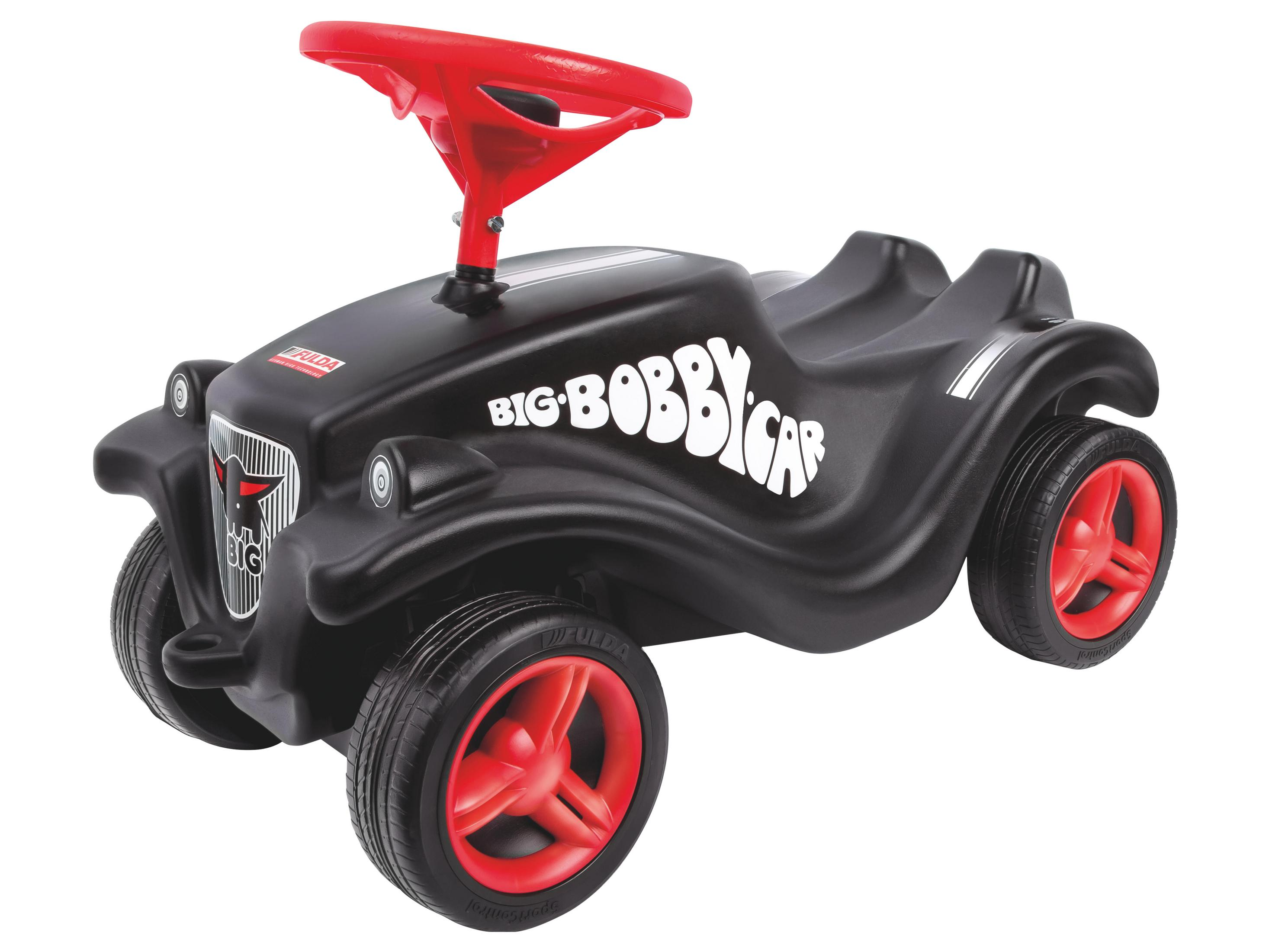 Ein schwarzes Kinderspielzeugauto mit roten Rädern und einem roten Lenkrad.