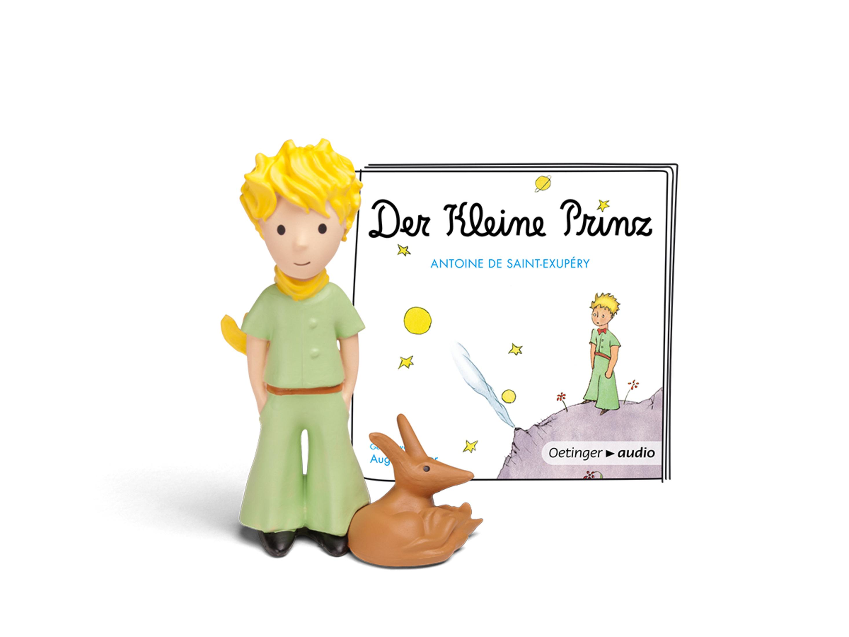 Eine kleine Prinz-Figur neben einem Buchcover, mit einem braunen Fuchs.