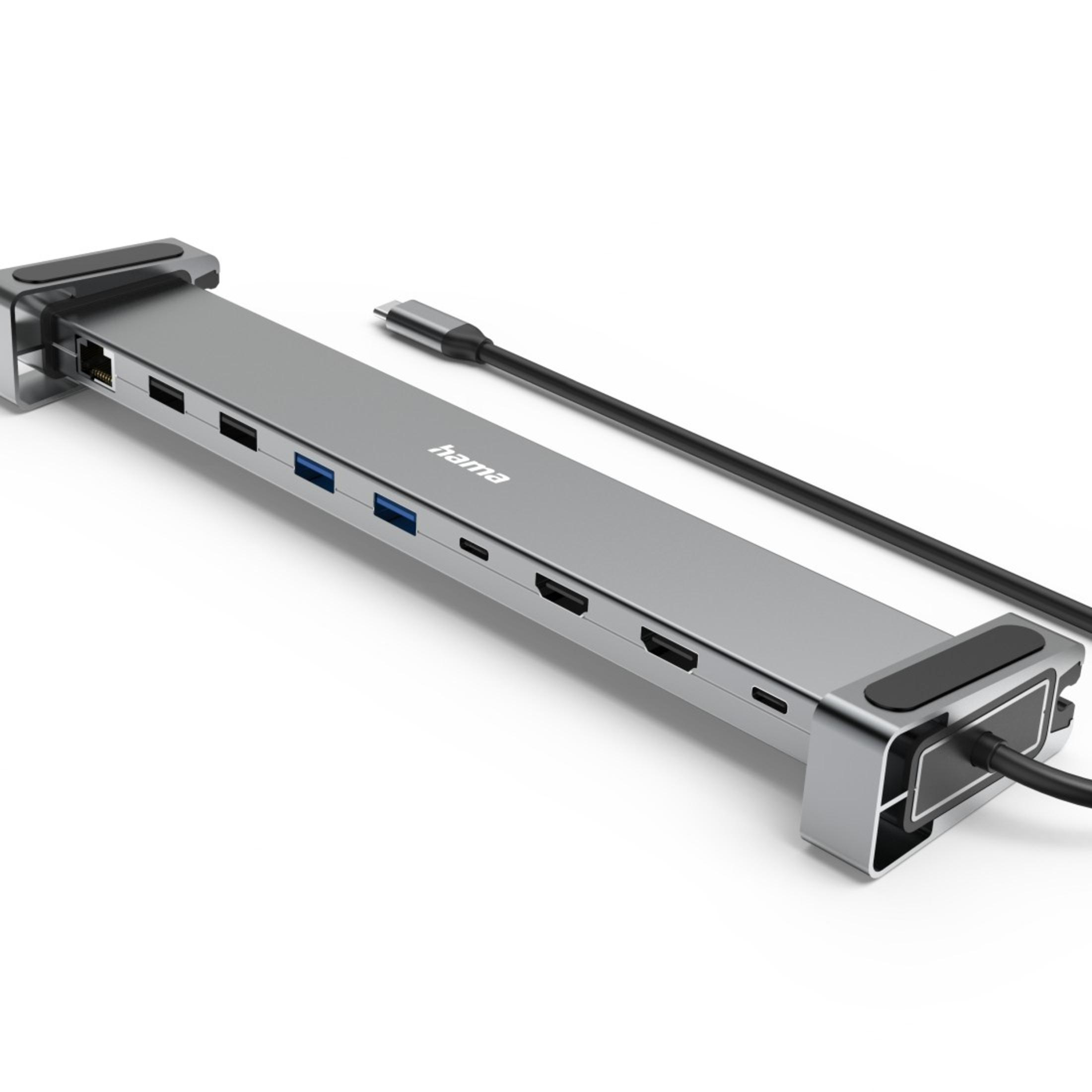 Srebrno-szary hub USB. Posiada wiele portów do przesyłania danych i zasilania.