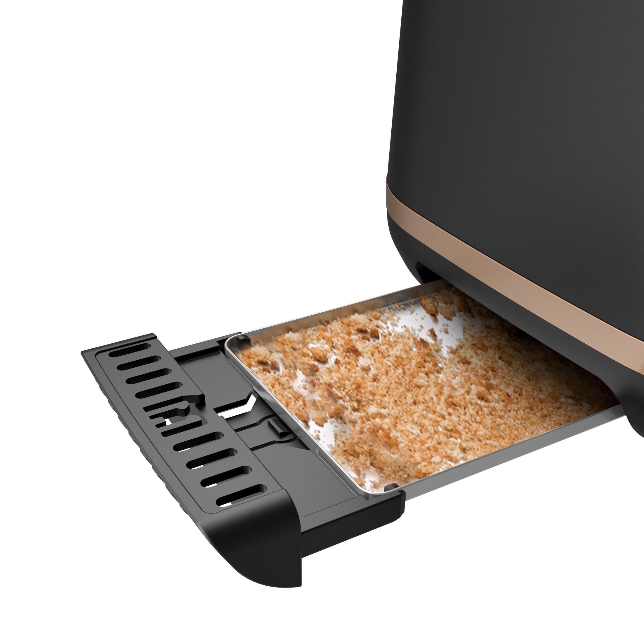 Toster z wysuniętą tacką na okruchy, pełną okruchów. Obudowa jest czarna i złota.