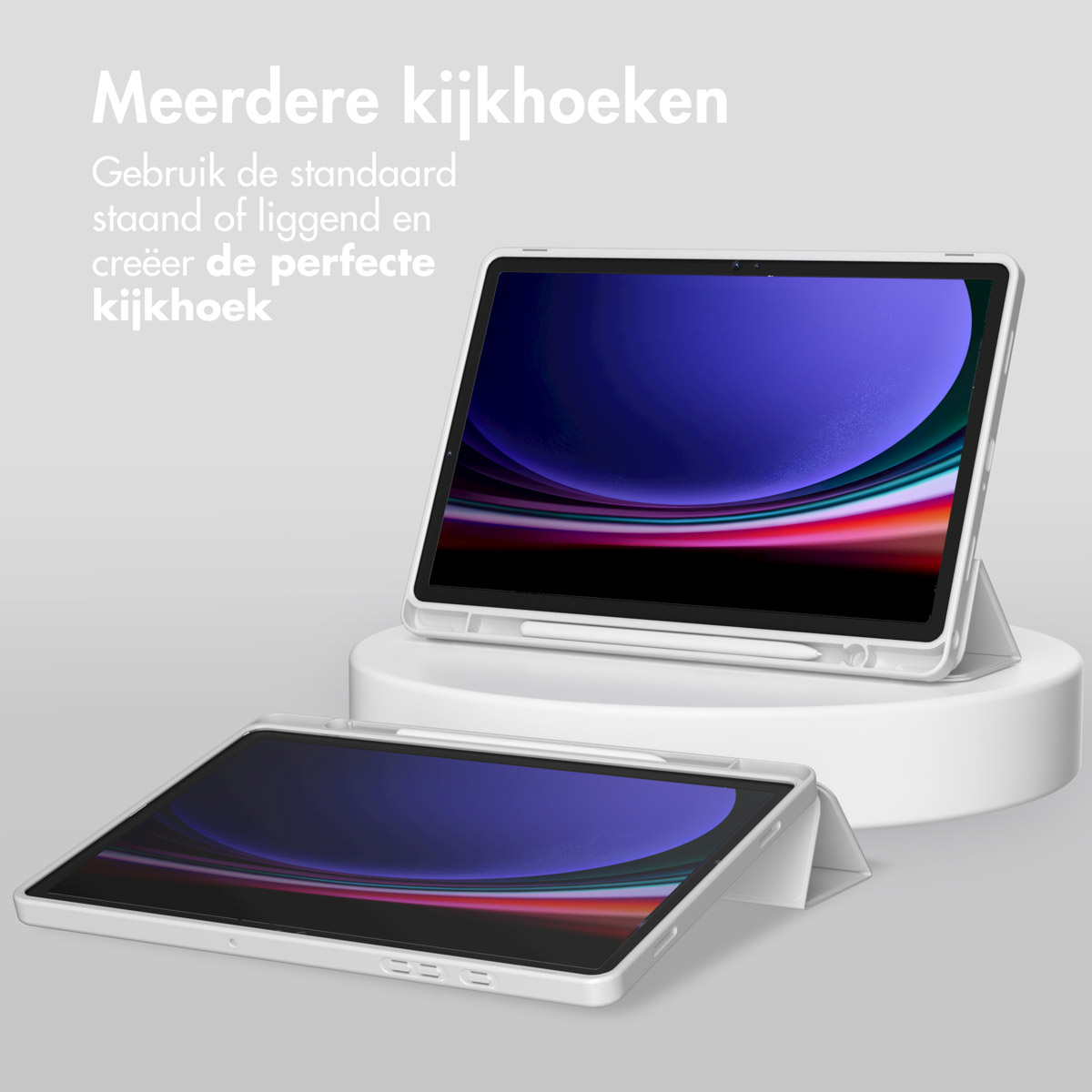 White tablet in stand, stylus, second tablet, light background, white stand.
