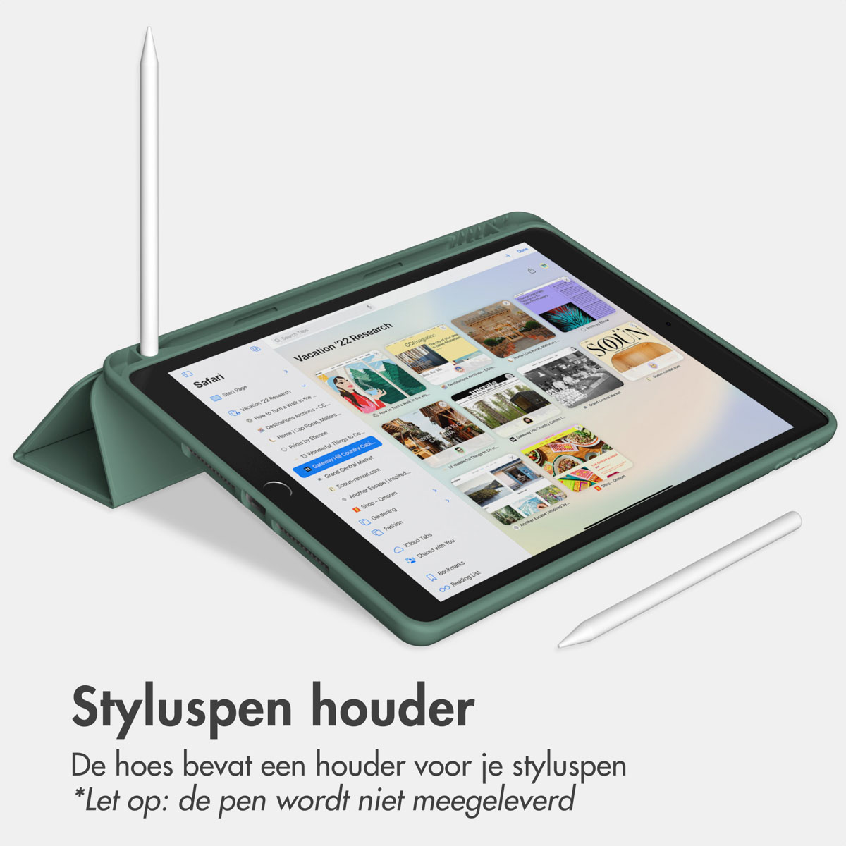 Green tablet, stylus in holder, second stylus, open, showing webpage, light background.