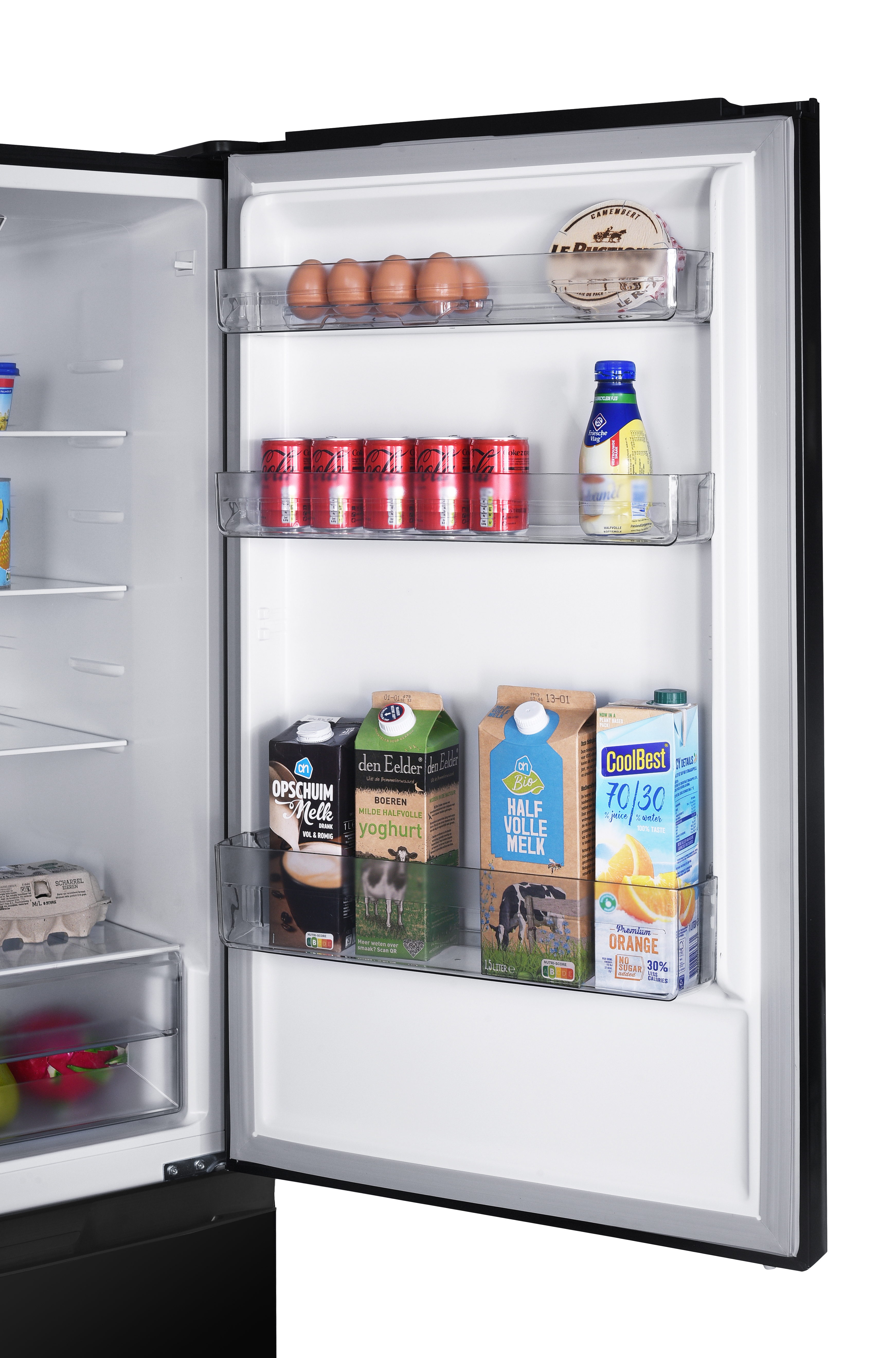 Fridge interior with shelves. Showing eggs, cheese, milk, juice and canned drinks.