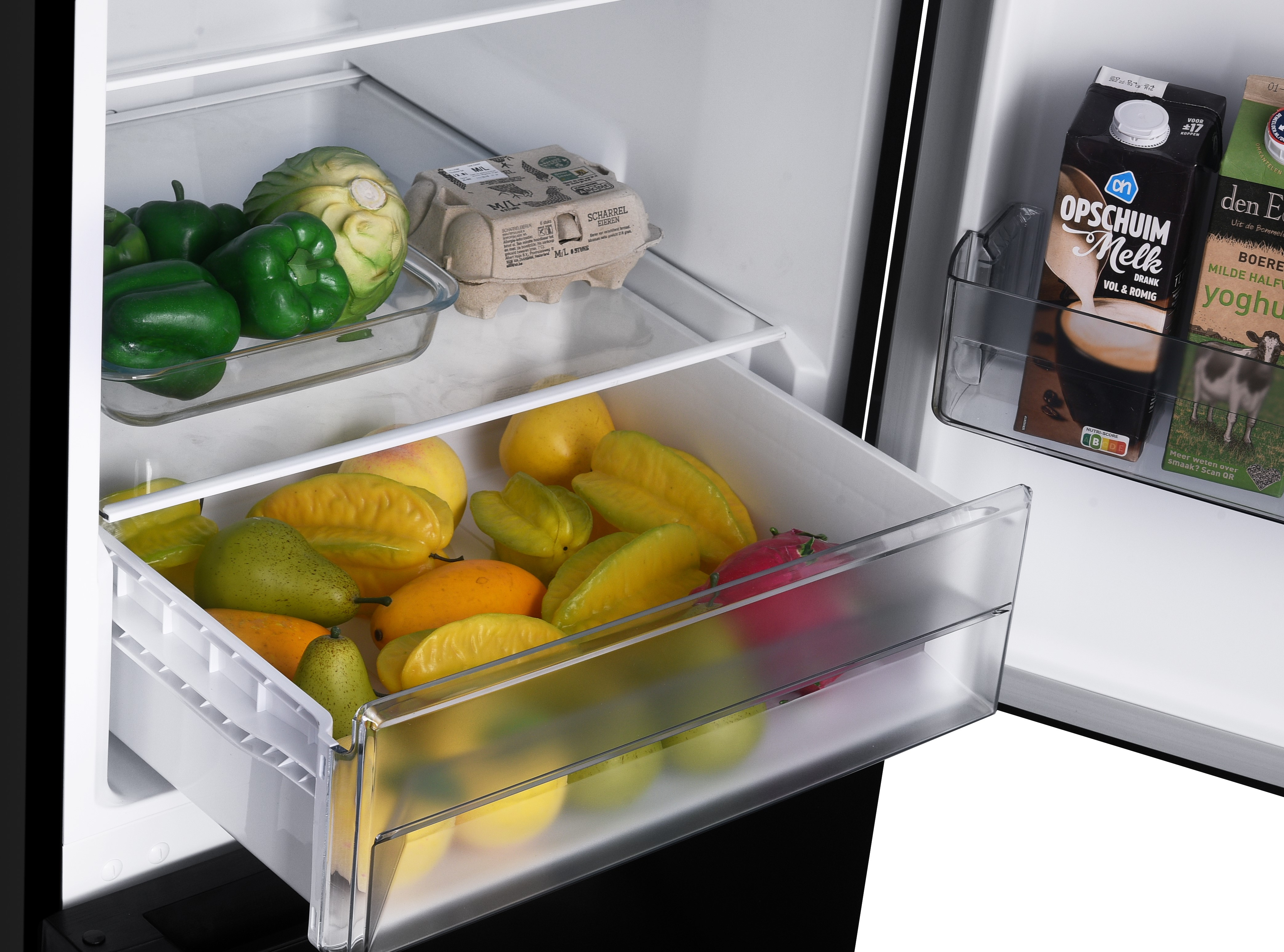 Refrigerator interior with fruits and vegetables in drawers and food containers.