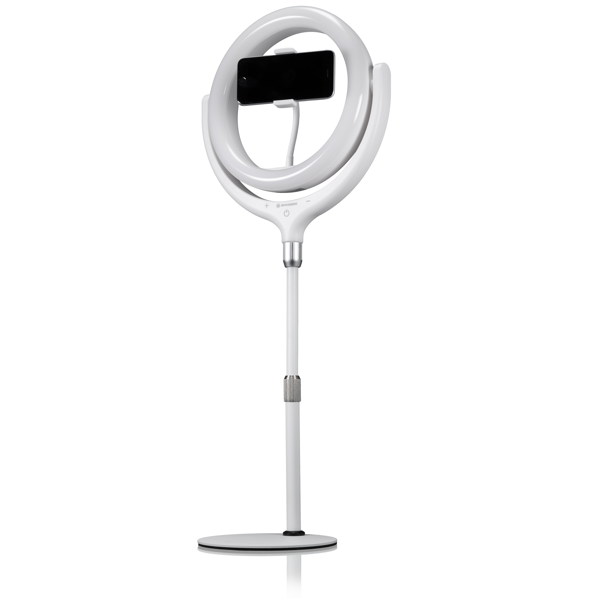 Una luz de anillo blanca con un teléfono adjunto. Se apoya en una base y poste blancos.