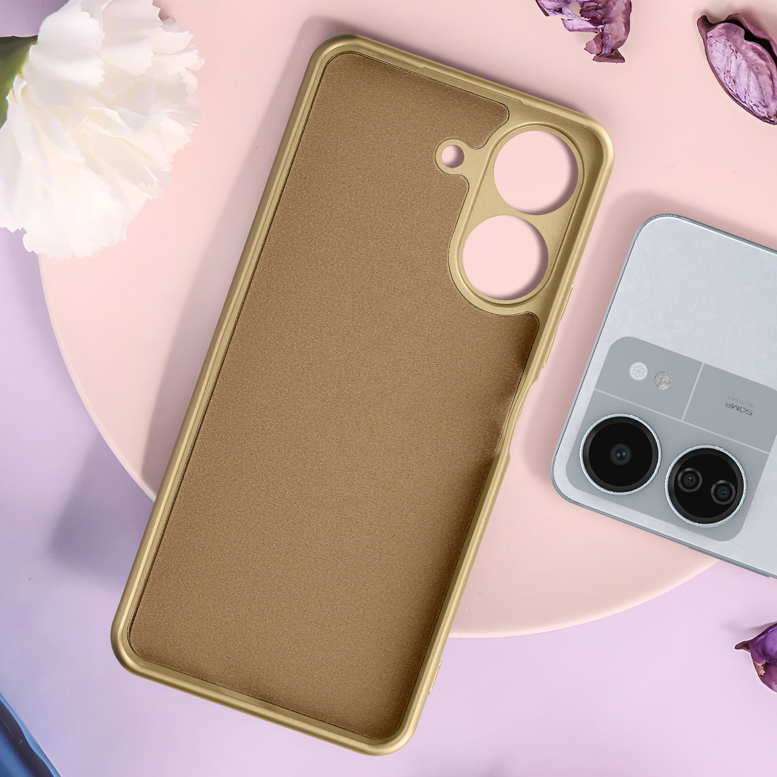 Handyhülle, goldener Rahmen, braune Mitte, mit Handy und Blumen auf rosa Fläche.